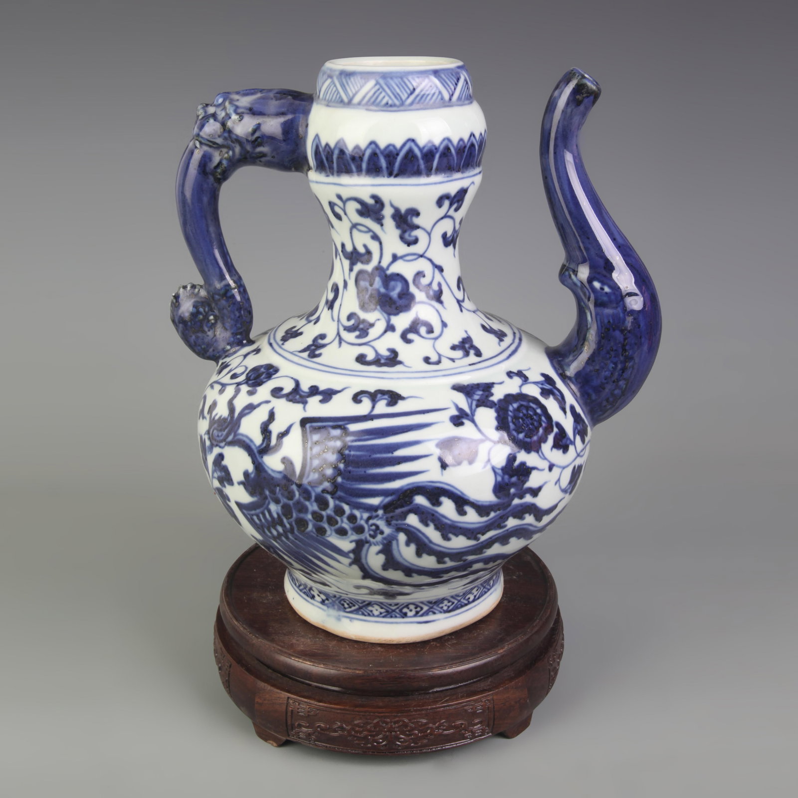 A FINE PHOENIX PATTERN BLUE AND WHITE GLAZED PORCELAIN EWER: Ming Dynasty Style; High: 11.0 inch; Diameter:8.5 inch; Woodbase for picture and display only