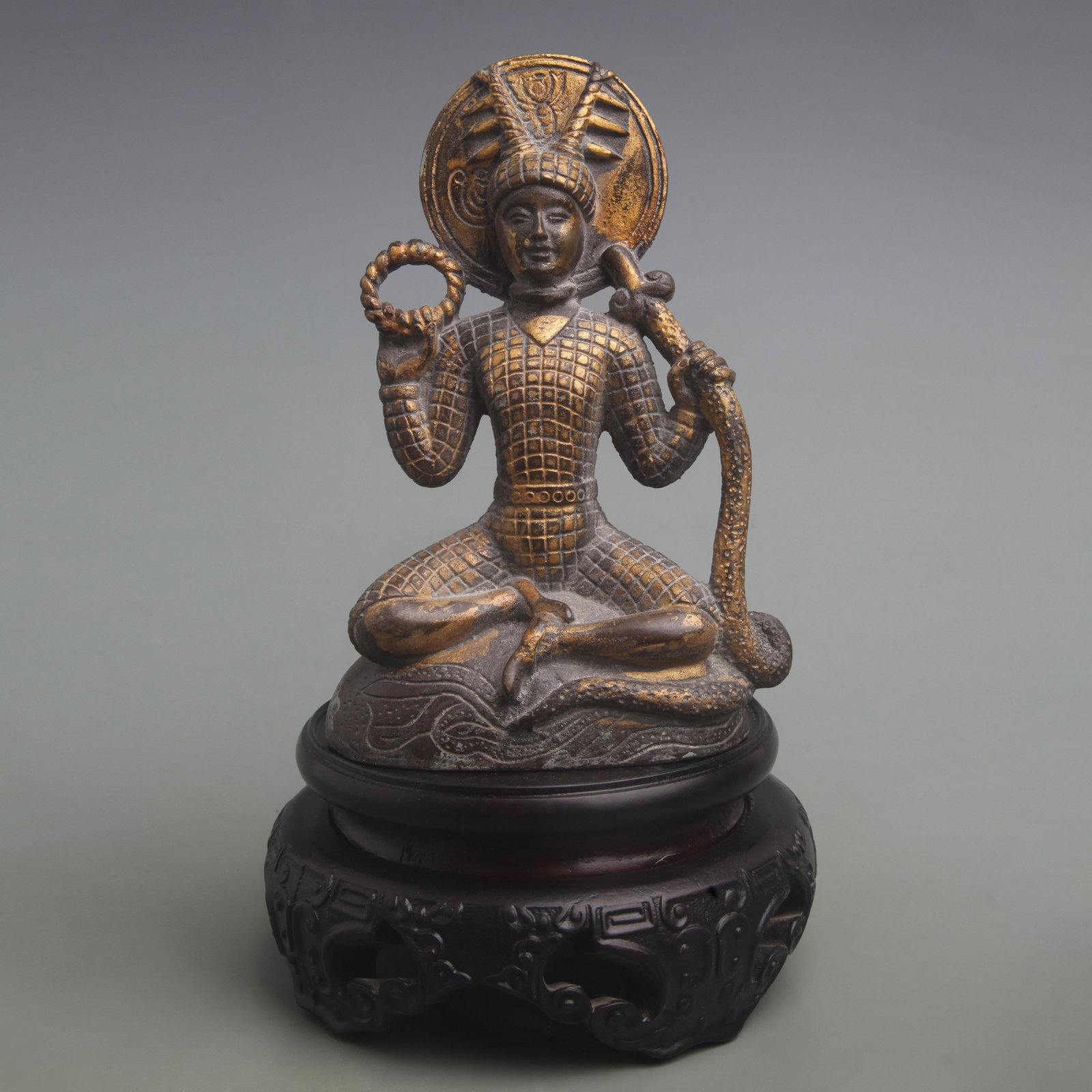 SERPENT-SHAPED BUDDHA STATUE: Qing Dynasty; High: 6.8 inch; Width: 4.2 inch; Woodbase for picture and display only