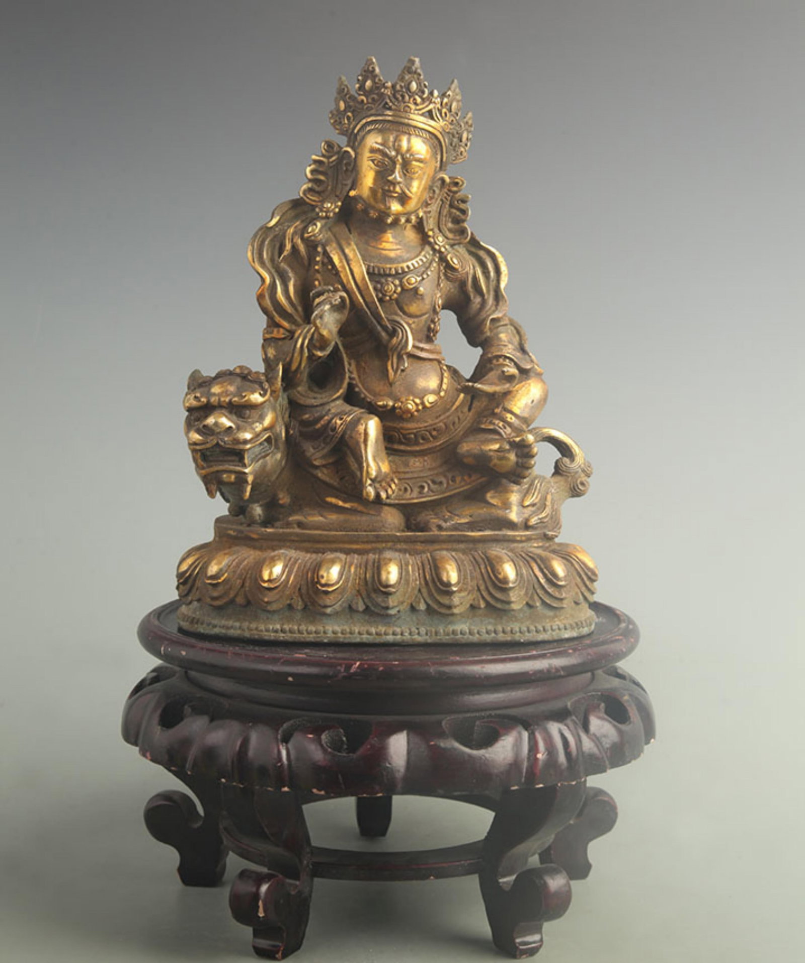 GILT BRONZE TIBETAN PROTECTOR DEITY STATUE: 19th Century; High: 9.80 inch; Width: 4.00 inch; Long: 5.00 inch; Woodbase for picture and display only