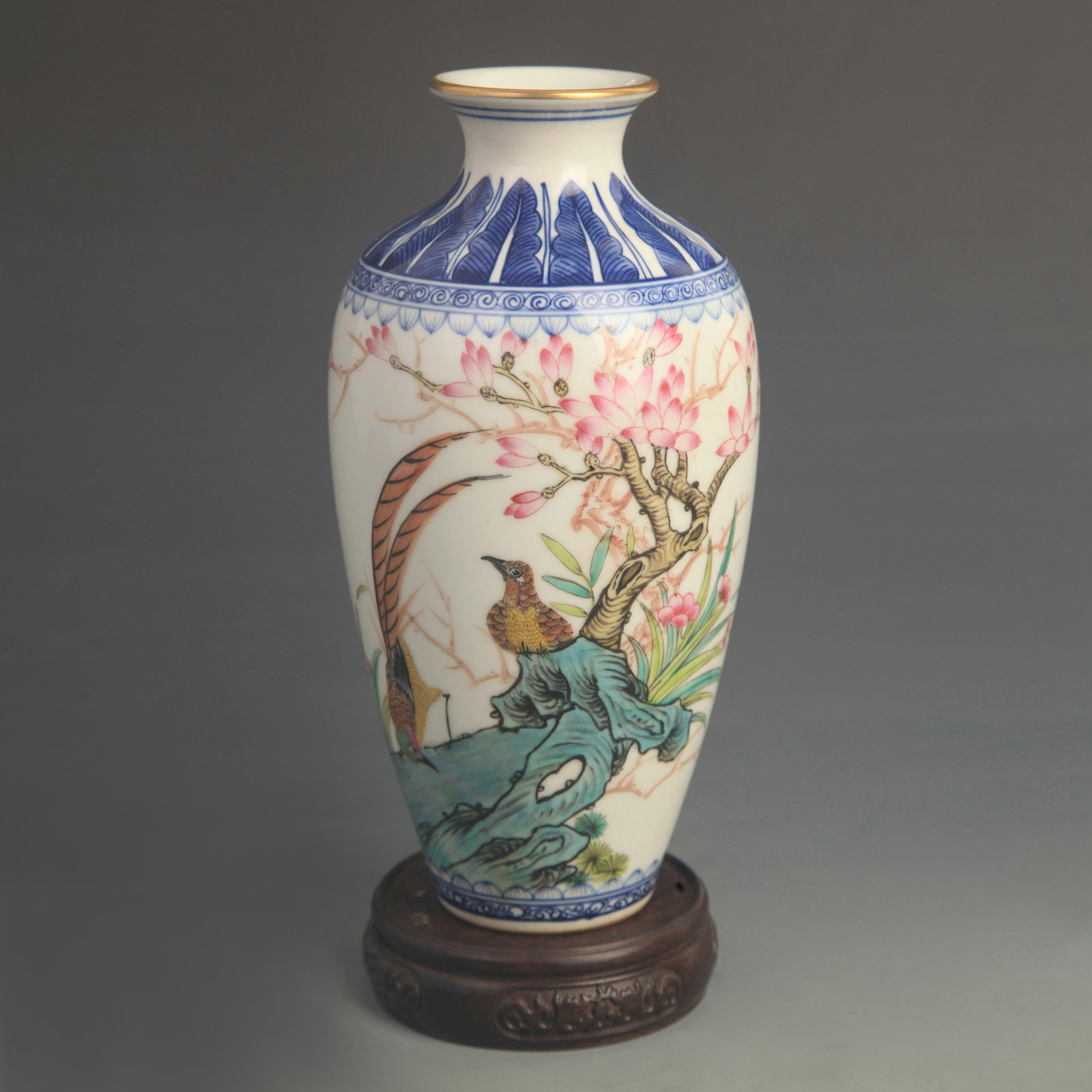 AN ENAMEL-PAINTED OPEN-MOUTH VASE WITH FLORAL AND BIRD DECORATION: Qing Dynasty Qian Long Period; High: 9.20 inch; Diameter: 4.50 inch; Woodbase for picture and display only