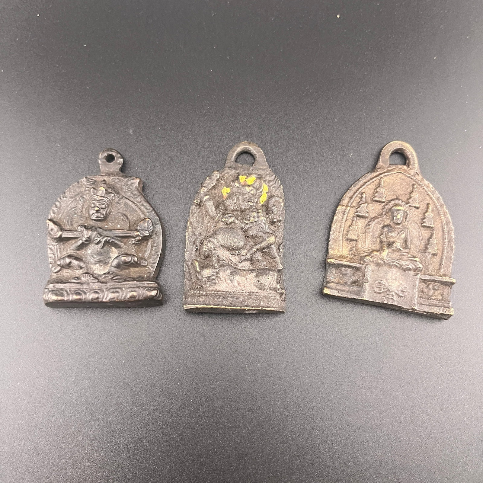 GROUP OF THREE RITUAL AMULET PENDANT: Qing Dynasty; Long: 2.2 inch; Width: 1.2 inch; High: 0.3 inch; Long: 2.2 inch; Width: 1.6 inch; High: 0.3 inch; Long: 2 inch; Width: 1.4 inch; High: 0.4 inch; Woodbase for picture and display only