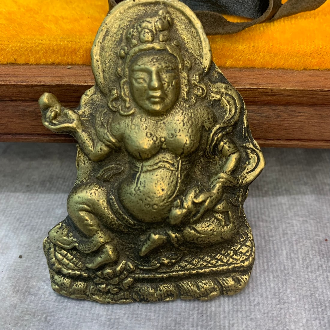 A FINE TIBETAN BUDDHIST INSTRUMENTS PENDANT: 19th Century; High: 3.0 inch; Width: 2.3 inch; Woodbase for picture and display only