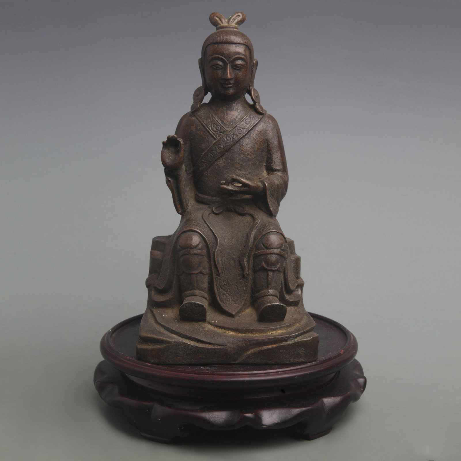 BRONZE SEATED DAOIST IMMORTAL: Qing Dynasty; High: 10.1 inch; Width: 9.8 inch; Woodbase for picture and display only