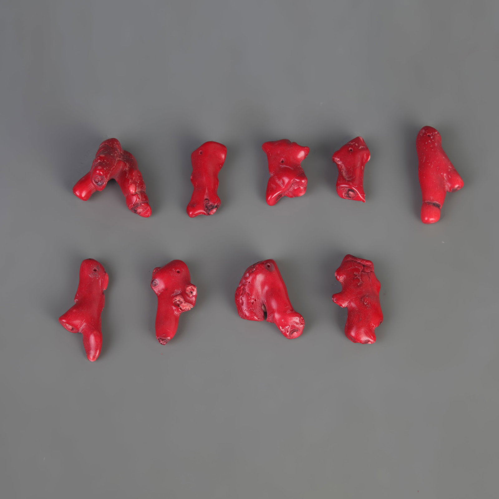 A GROUP OF CORAL PENDANTS: Modern; Long: 1.0 inch to 2.5 inch; Woodbase for picture and display only