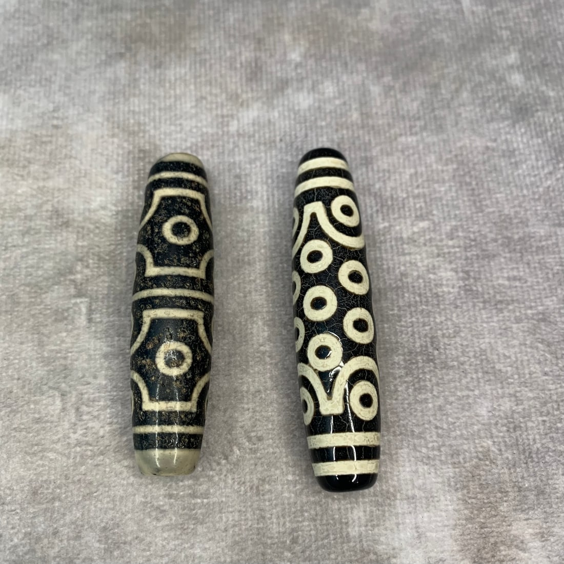 GROUP OF TWO TIBETAN BUDDHISM TIAN ZHU PENDANT: Modern; High: 2.3 inch; Diameter: 0.5 inch; Woodbase for picture and display only