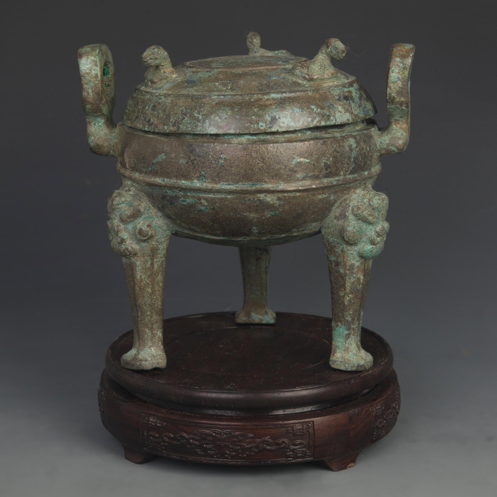 AN ARCHAISTIC BRONZE DING WITH ANIMAL MASK AND APPLIED HANDLES (1 of 5)