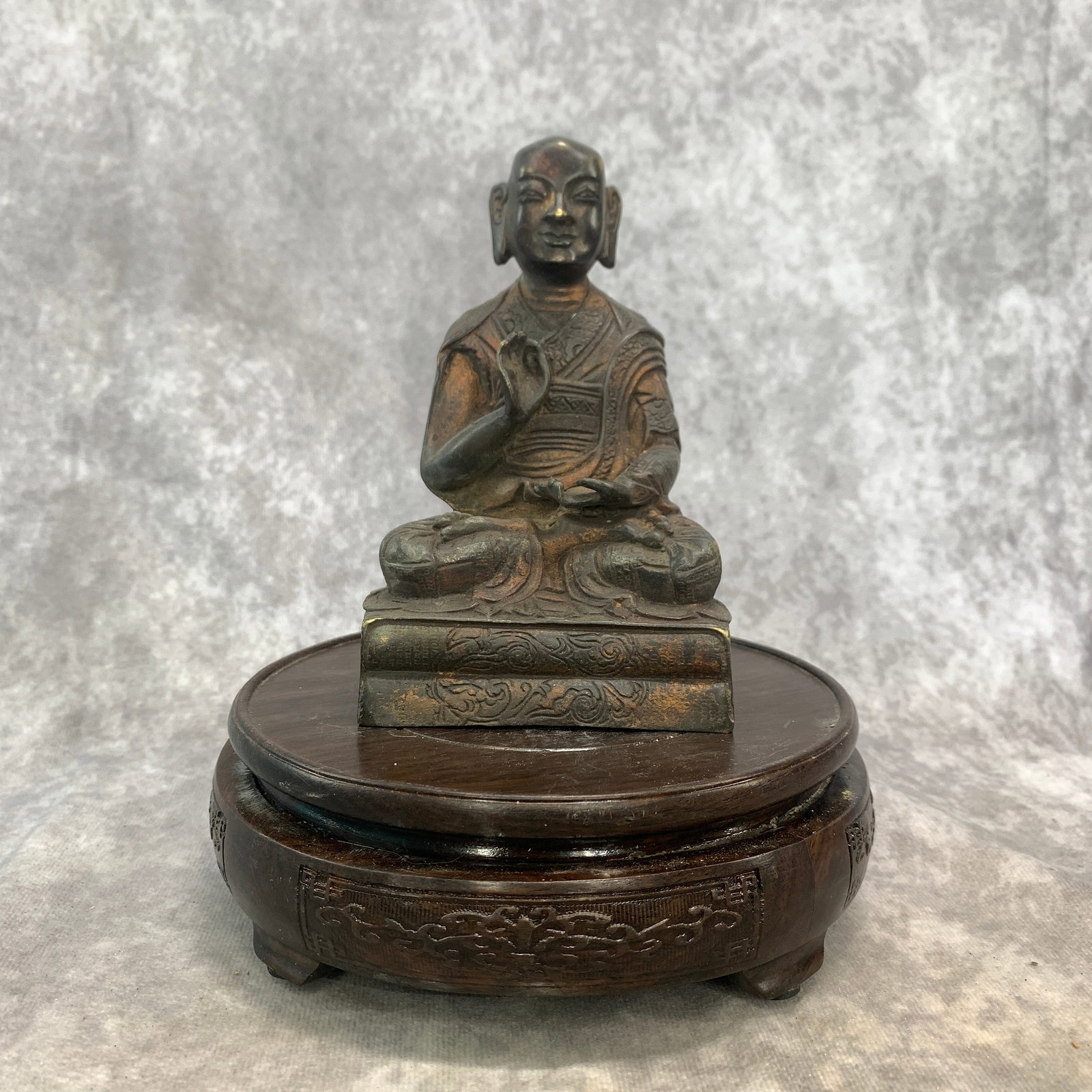 A FINE BRONZE SEATED ARHAT: 19th Century; Long: 3.5 inch; Width:2.6 inch; Heigh: 5.4 inch; Woodbase for picture and display only