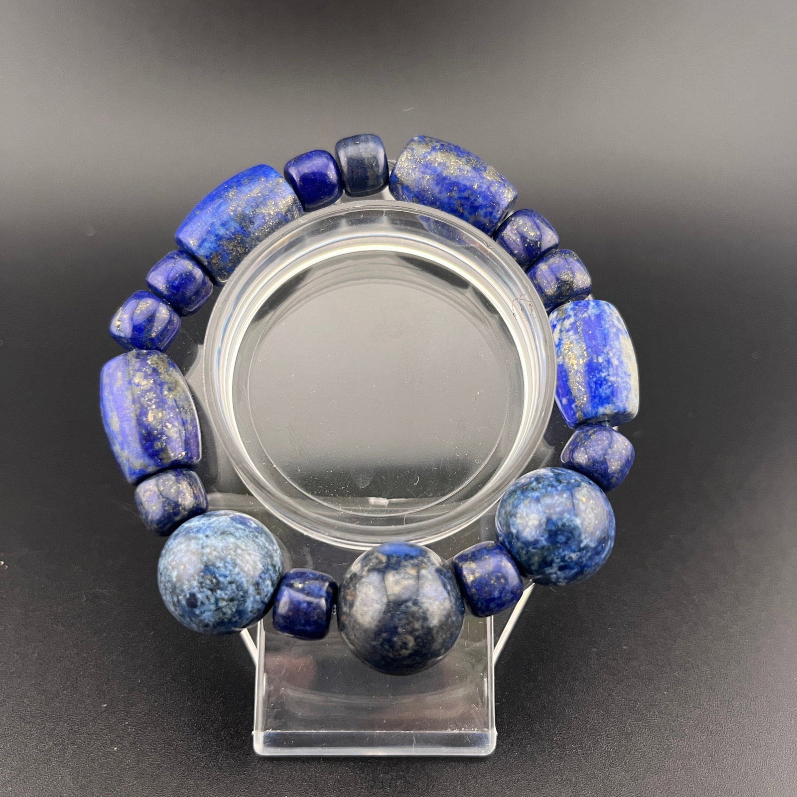 LAPIS LAZULI "MOON AND STAR" BRACELET: Modern; Long: 4 inch; Diameter: 0.5 inch; Woodbase for picture and display only