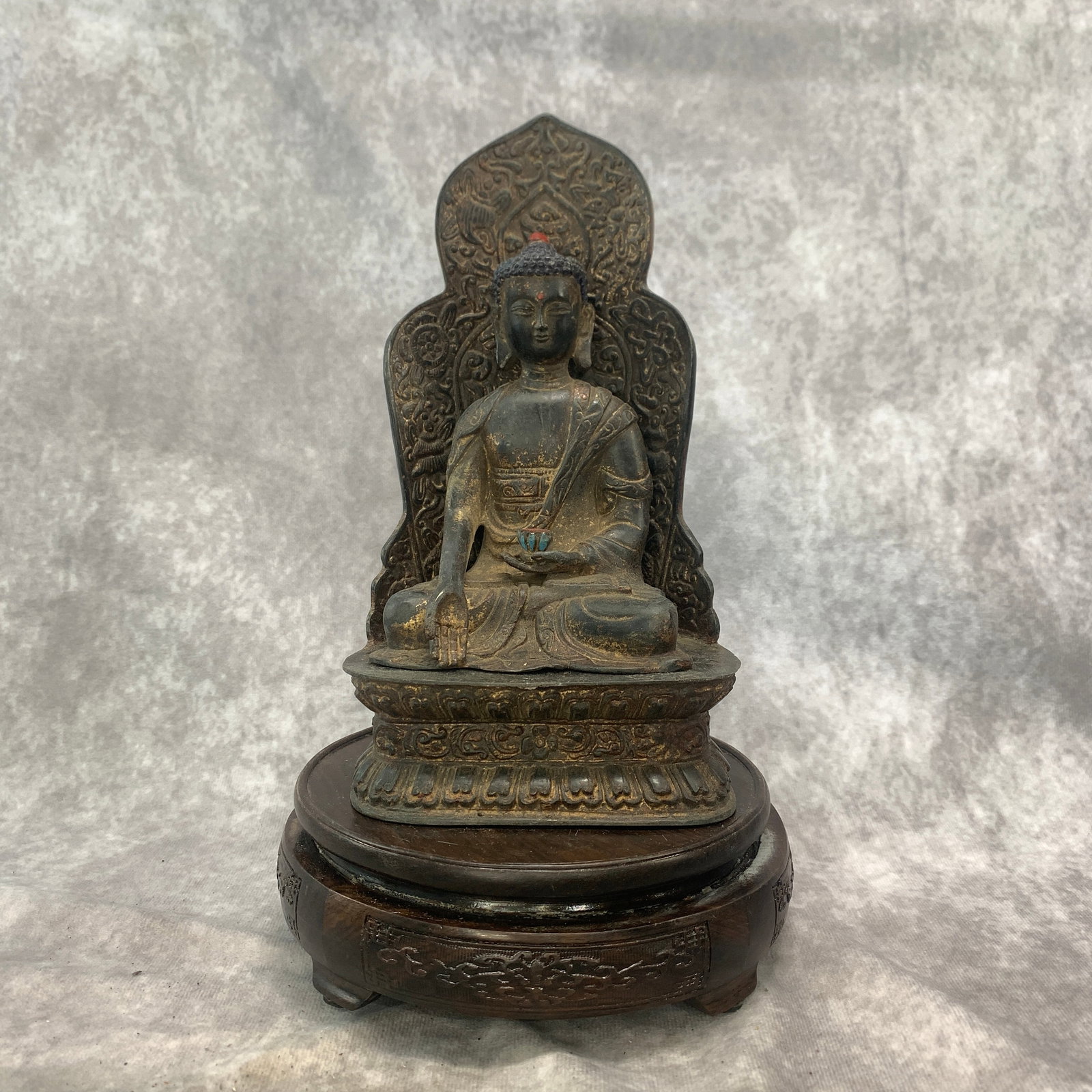 BRONZE SHAKYAMUNI BUDDHA WITH MANDORLA: Republic Period; Long: 4.8 inch; Width:3.6 inch; Heigh: 8.8 inch; Woodbase for picture and display only
