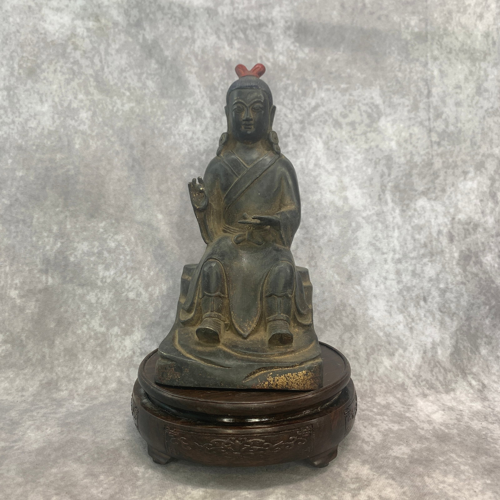 A FINE BRONZE SEATED IMMORTAL (1 of 5)