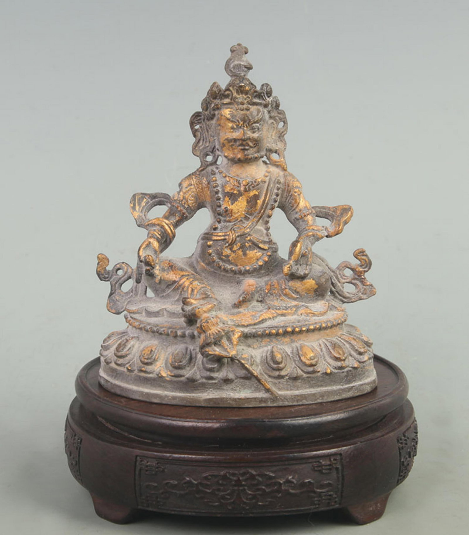 A FINE GILT BRONZE TIBETAN BUDDHISM GOD OF WEALTH: 20th Century; High: 5.20 inch; High: 3.20 inch; Long: 4.30 inch; Woodbase for picture and display only