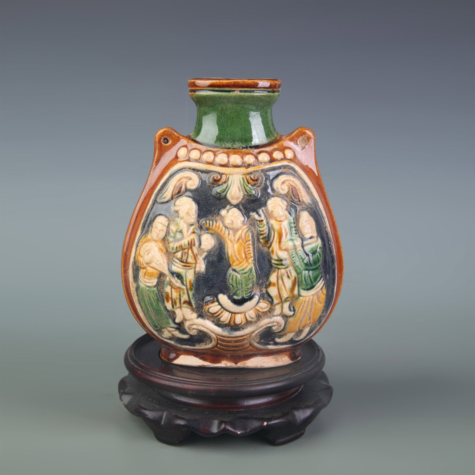 A SANCAI-GLAZED FIGURAL PATTERN OLD PORCELAIN EWER: Tang Dynasty Style; Width: 5.0 inch; High: 6.5 inch; Woodbase for picture and display only