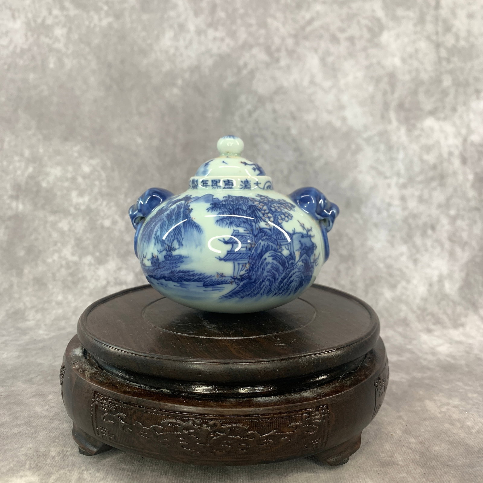 BLUE AND WHITE "LANDSCAPE" PATTERN PORCELAIN BOTTLE: Qing Dynasty; Long: 4.3 inch; Width:3.8 inch; Heigh: 3.6 inch; Woodbase for picture and display only