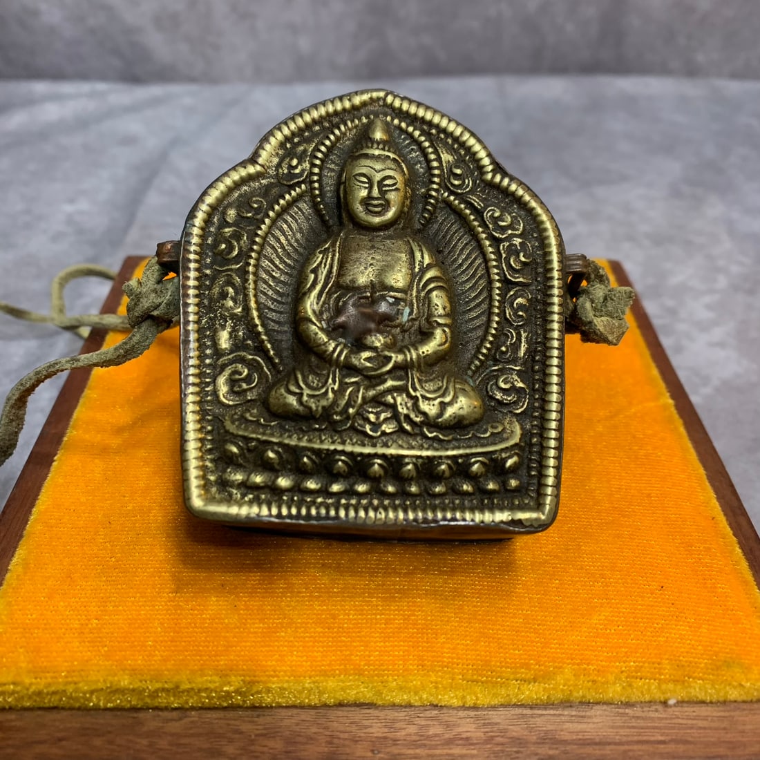 A FINE TIBETAN BUDDHIST RITUAL PENDANT: 20th Century; Width: 2.8 inch; High: 3.3 inch; Woodbase for picture and display only