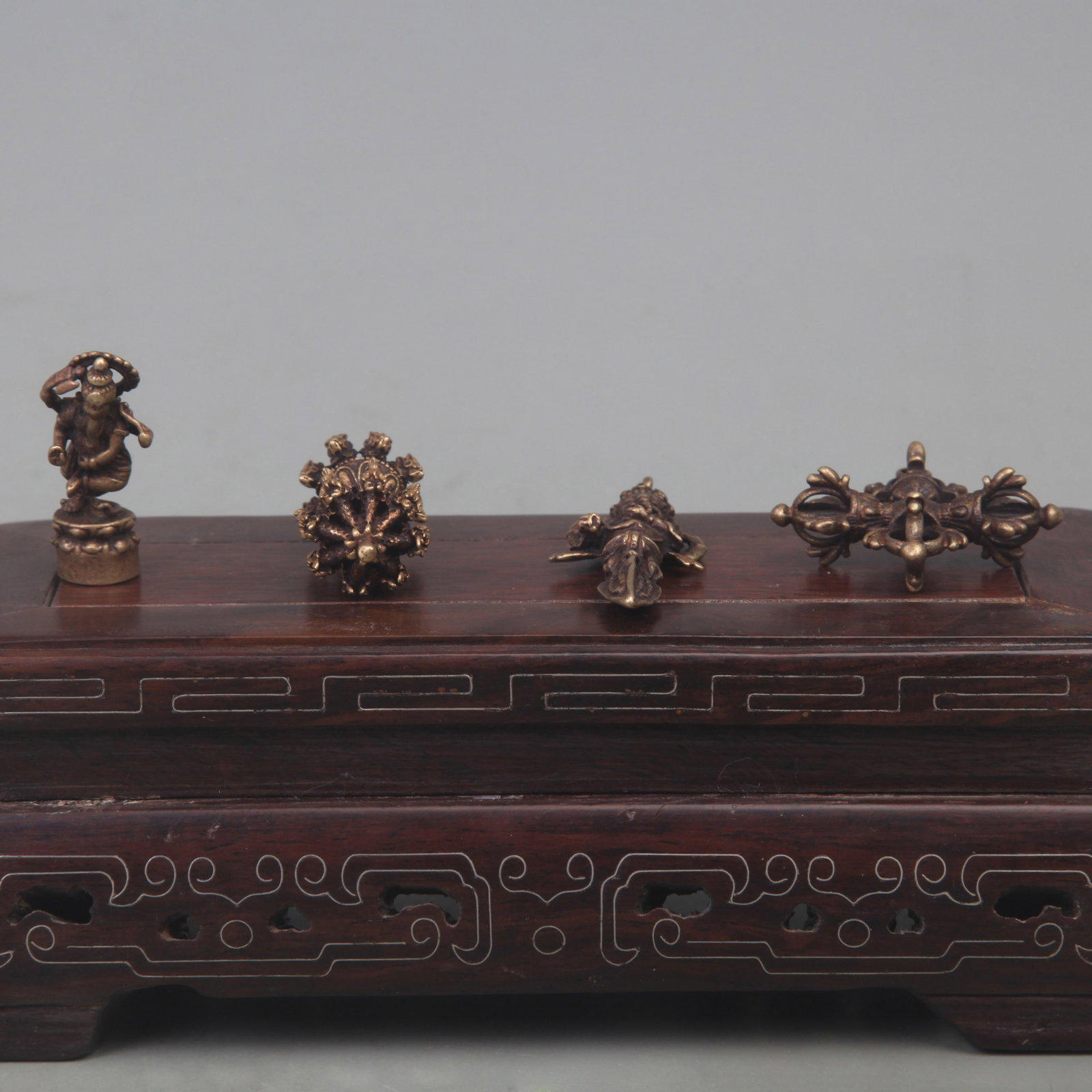 TIBETAN BUDDHIST STATUES AND RITUAL IMPLEMENTS: Qing Dynasty; Long: 2.2-1.5 inch; Woodbase for picture and display only