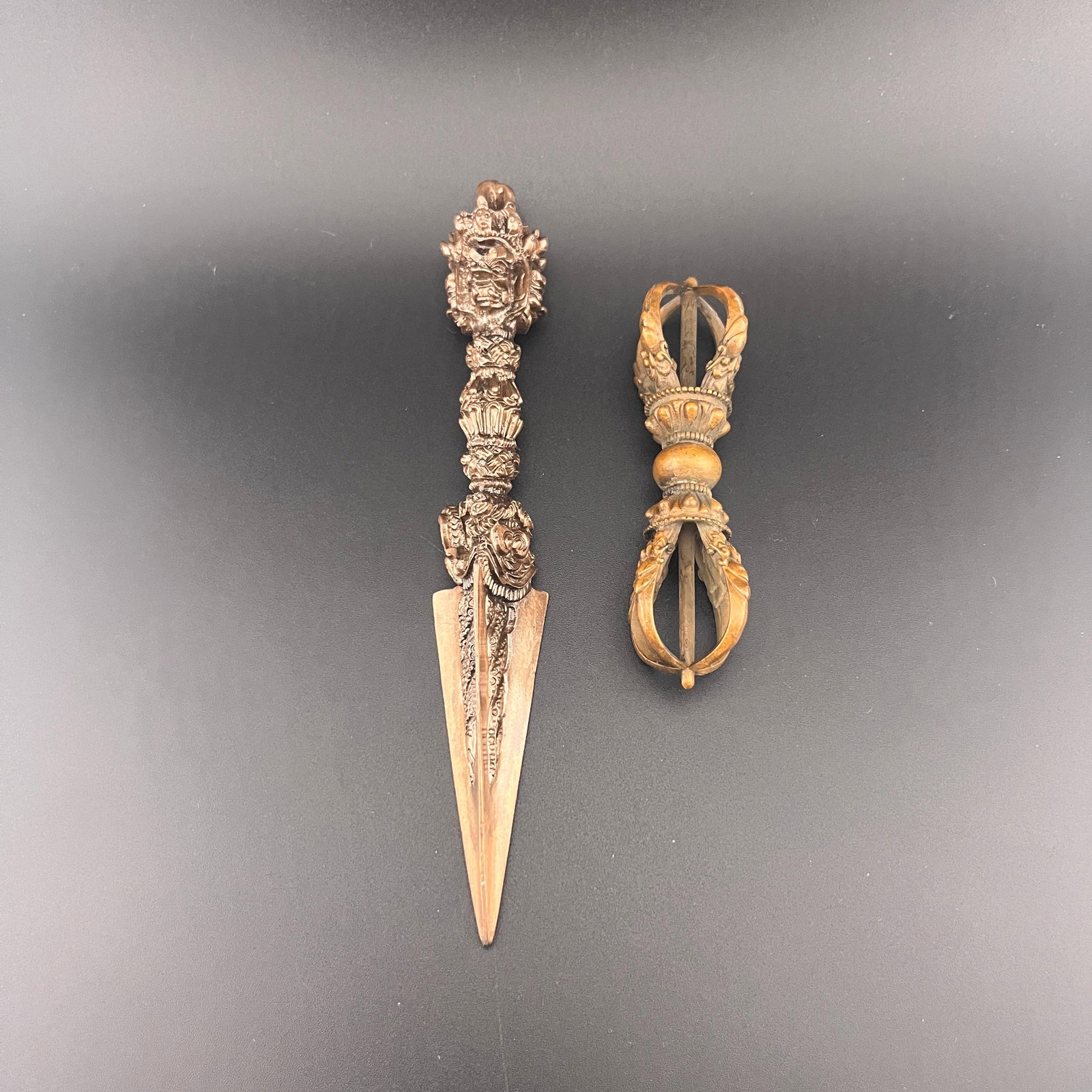 GROUP OF TIBETAN VAJRA AND PHURBA RITUAL IMPLEMENTS: Qing Dynasty; Long: 6.6 inch; Diameter: 1 inch; Long: 3.7 inch; Diameter: 1.2 inch; Woodbase for picture and display only