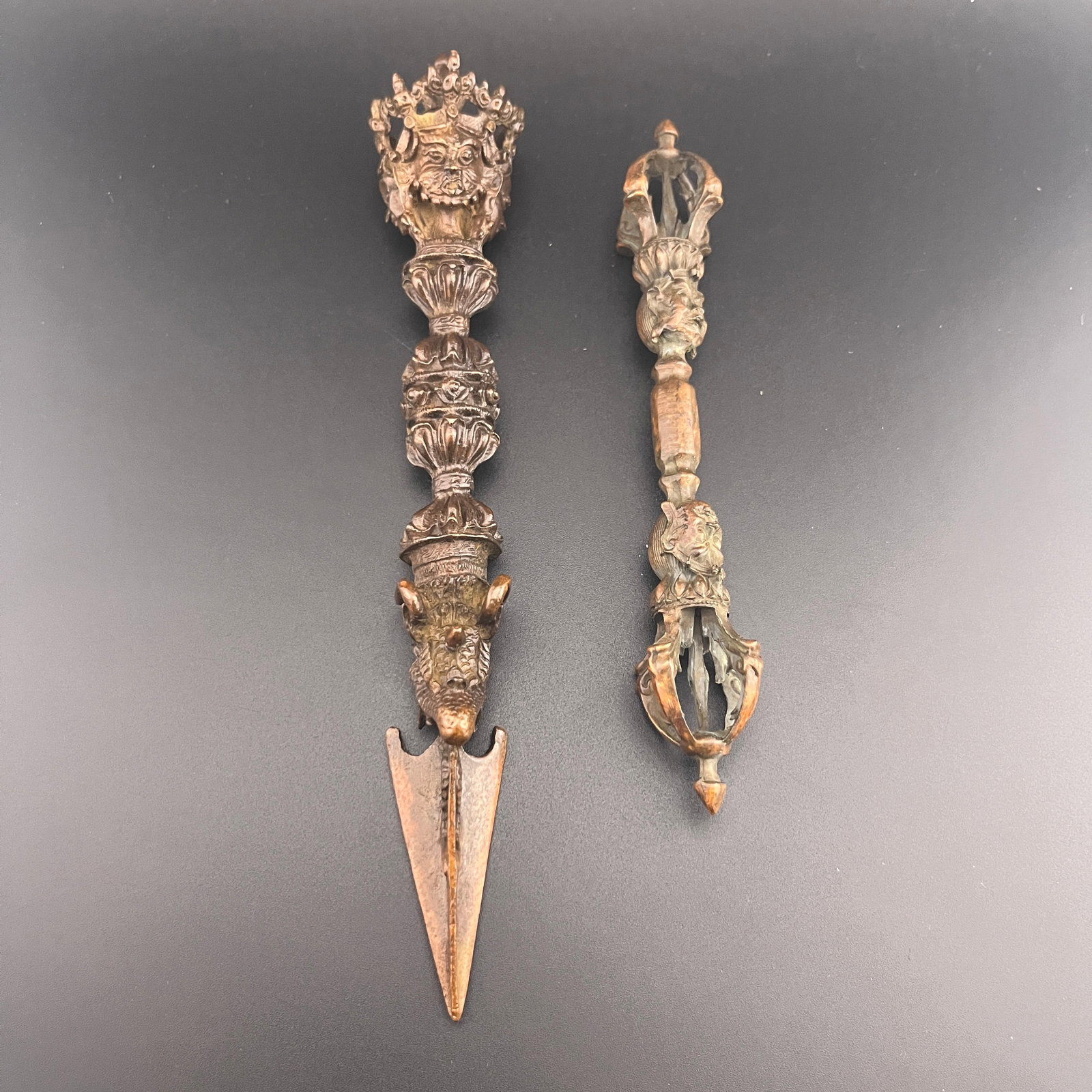 GROUP OF TIBETAN VAJRA AND PHURBA RITUAL IMPLEMENTS: Qing Dynasty; Long: 8 inch; Diameter: 1.3 inch; Long: 6.2 inch; Diameter: 1.1 inch; Woodbase for picture and display only