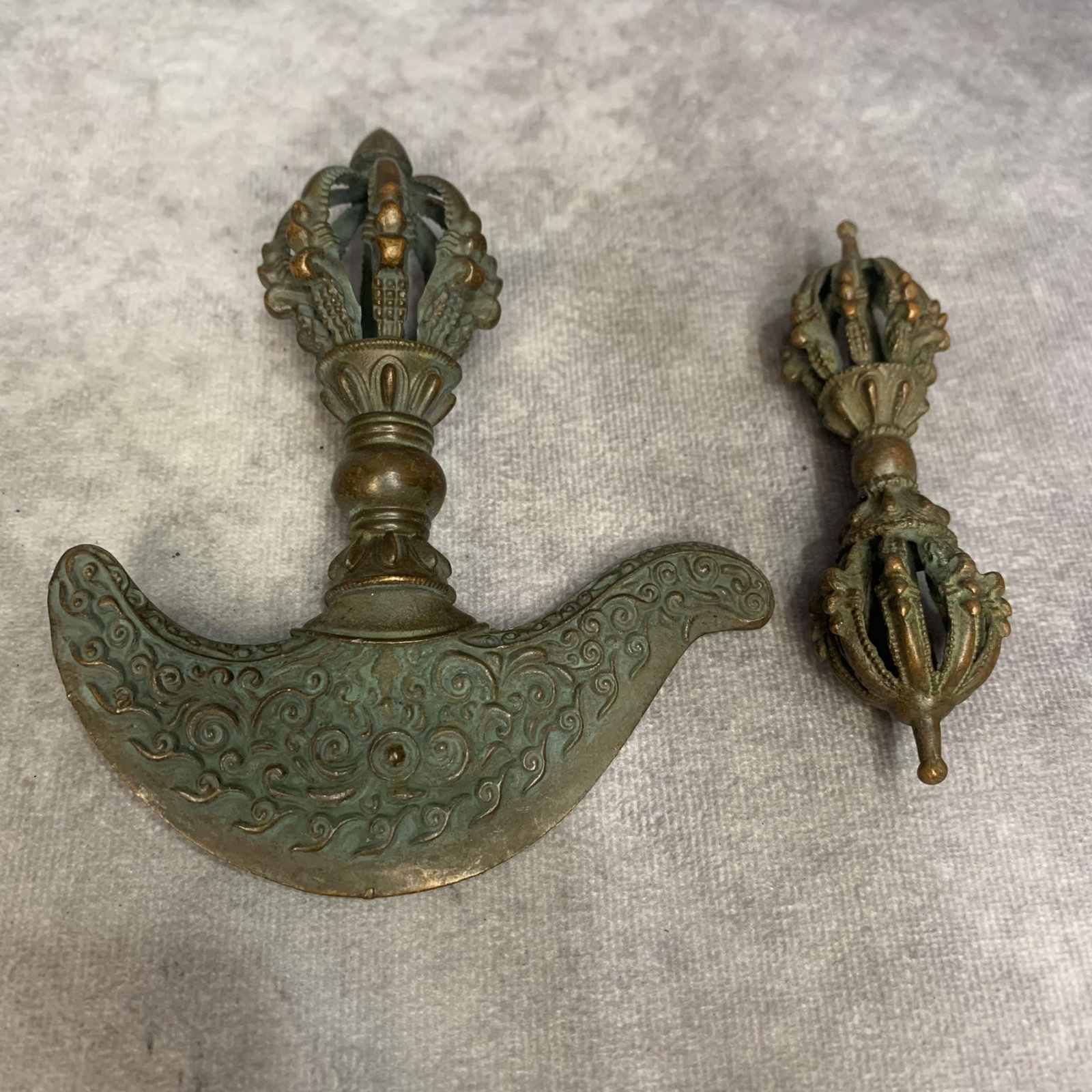 GROUP OF TWO TIBETAN BUDDHISM RITUAL INSTRUMENTS: 20th Century; High: 4.7 inch; Width: 4.1 inch. High: 3.7 inch; Width: 0.9 inch. ; Woodbase for picture and display only
