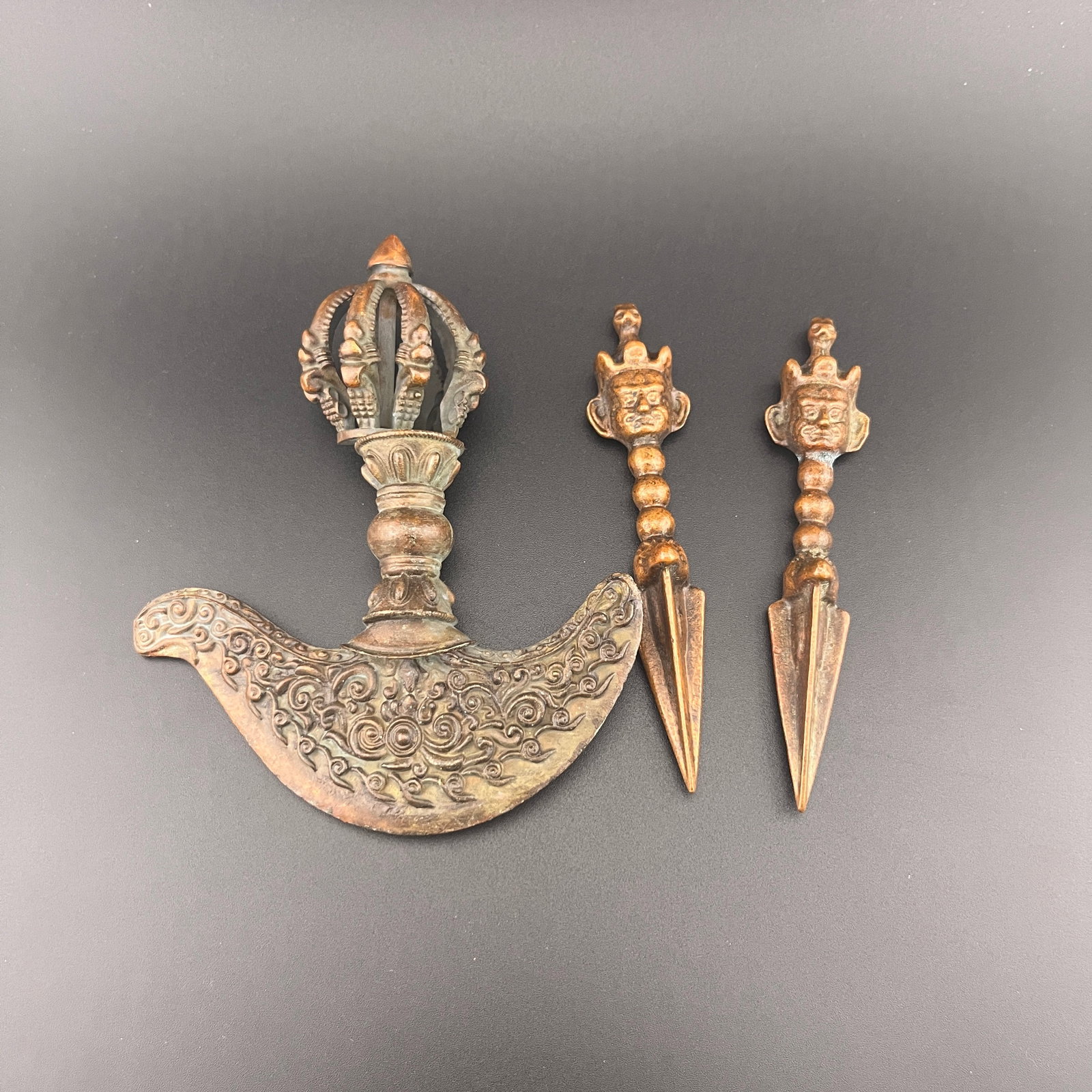 GROUP OF TWO TIBETAN BUDDHISM RITUAL INSTRUMENTS: Modern; Long: 4.8 inch; Width:4.05 inch; Long: 4.2 inch; Width:0.9 inch; Woodbase for picture and display only