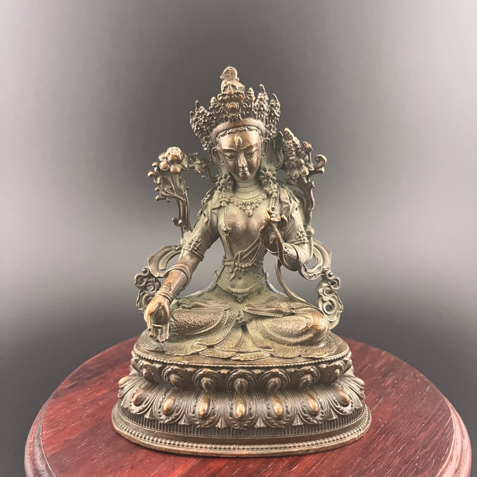 A SMALL BRONZE WHITE TARA STATUE: 19th Century; Long: 3 inch; Width:2.1 inch; Heigh: 4 inch; Woodbase for picture and display only