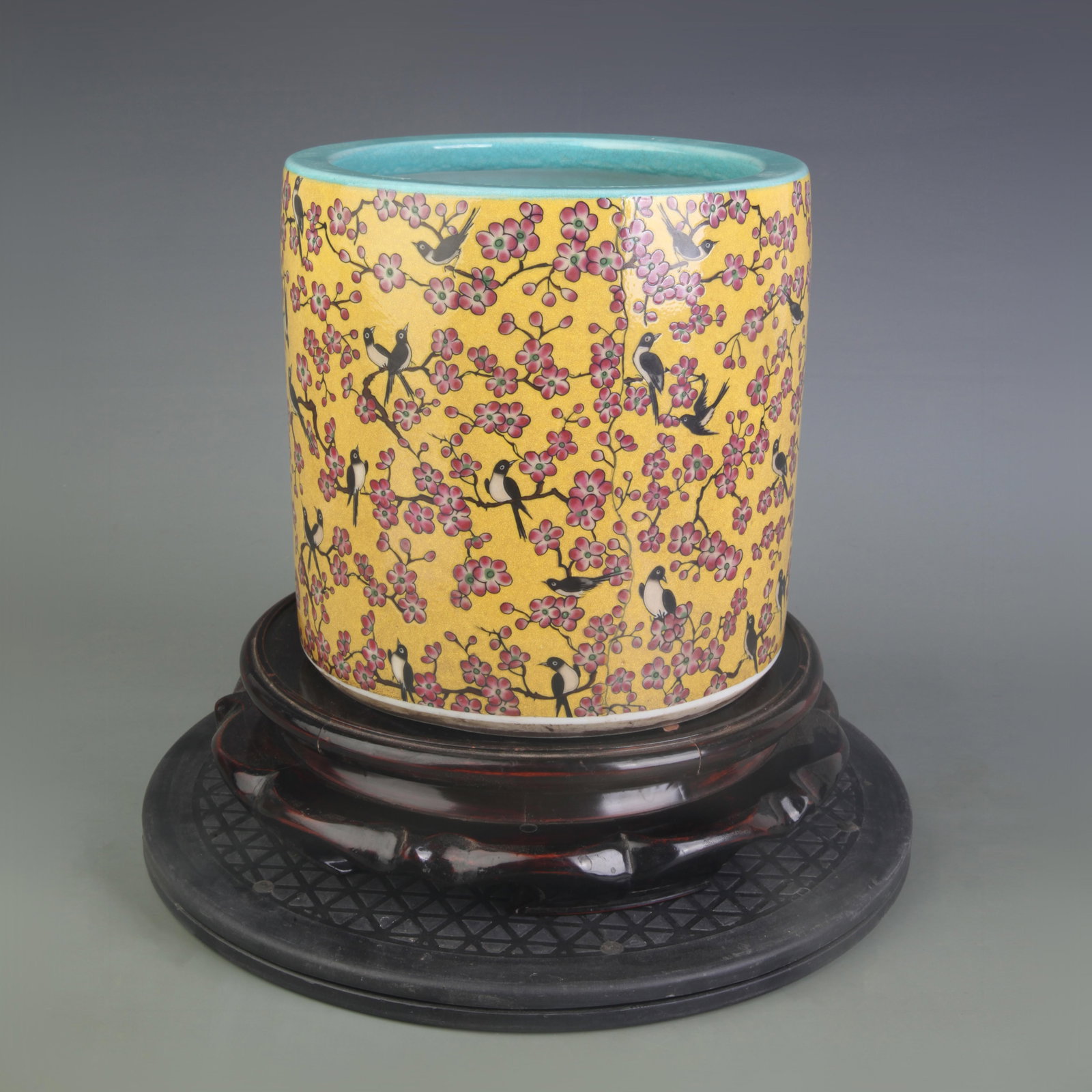 A FAMILLE-ROSE YELLOW-GROUND FLORAL AND BIRD BRUSH POT: Qing Dynasty; Diameter: 7.6 inch; High: 7.6 inch; Woodbase for picture and display only