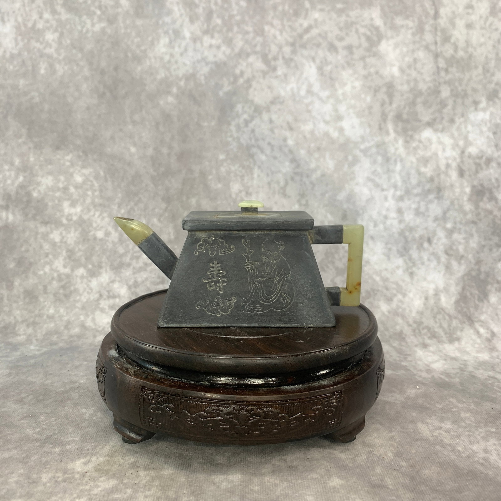 A FINE YIXING ZISHA TEA POT WITH JADE HANDLE AND JADE MOUTH: Modern; Long: 5.7 inch; Width:2.5 inch; Heigh: 2.6 inch; Woodbase for picture and display only