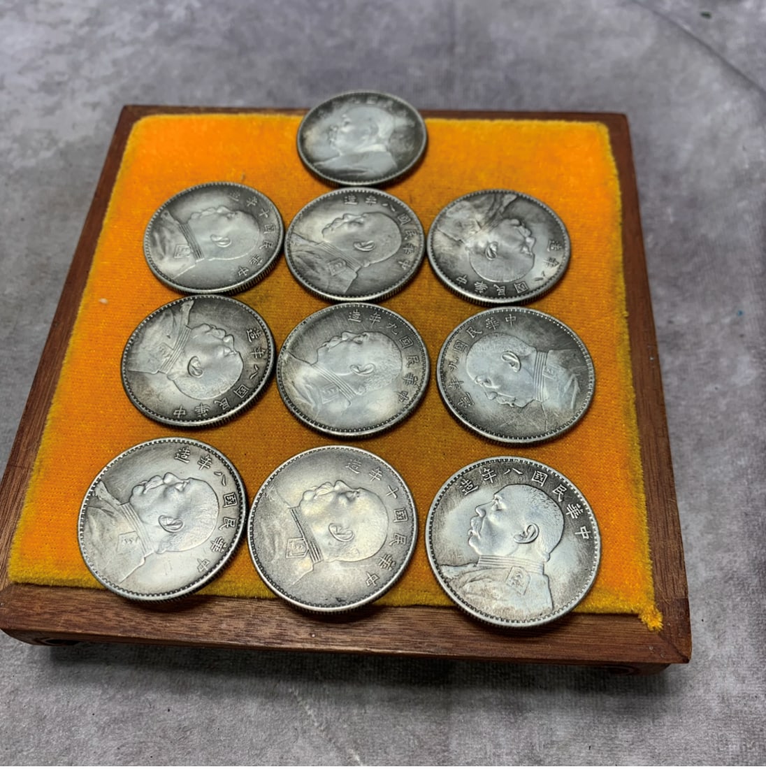 REPUBLIC OF CHINA YUAN SHIKAI PORTRAIT SILVER COINS, A GROUP OF TEN: ; Republic Period; Diameter: 1.5 inch; Woodbase for picture and display only