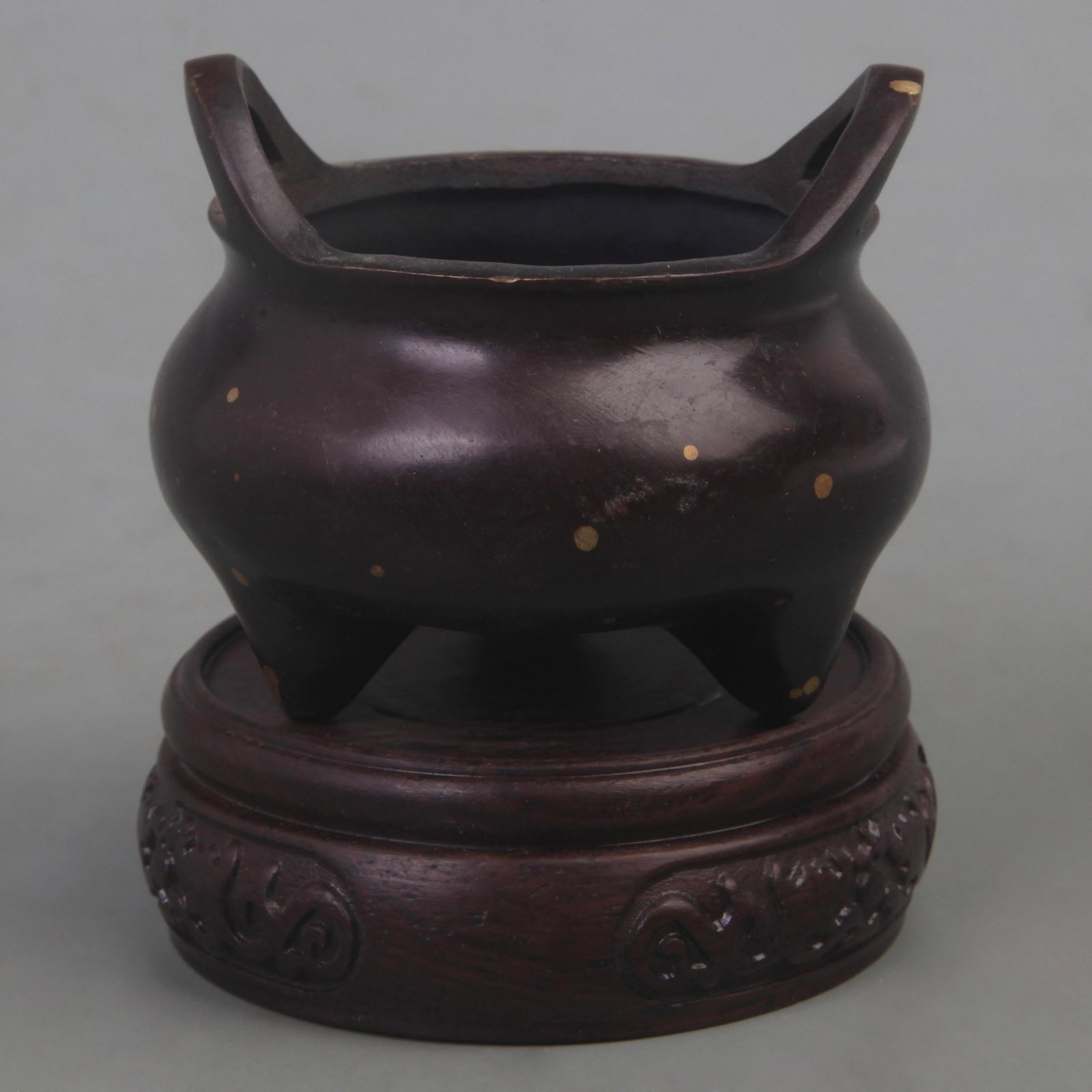 XUAN DE STYLE BRONZE TRIPOD INCENSE BURNER WITH BRIDGE-SHAPED EARS, THREE FEET, AND GOLD ACCENTS: Ming Dynasty Style; Diameter: 3 inch; High: 2.2 inch; Woodbase for picture and display only