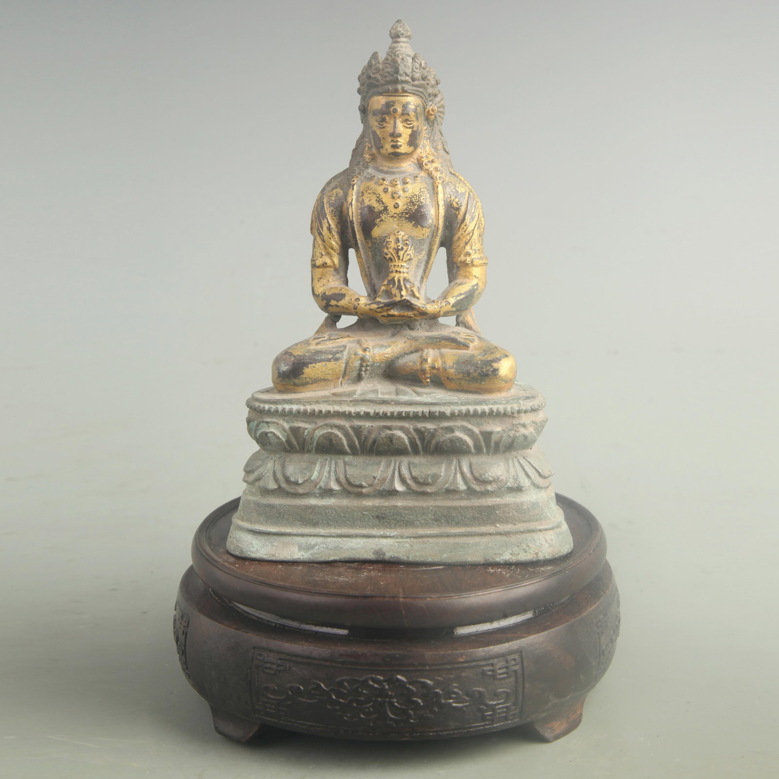 GILT BRONZE MANJUSHRI BODHISATTVA: 18th Century; High: 6.30 inch; Width: 4.20 inch; Woodbase for picture and display only