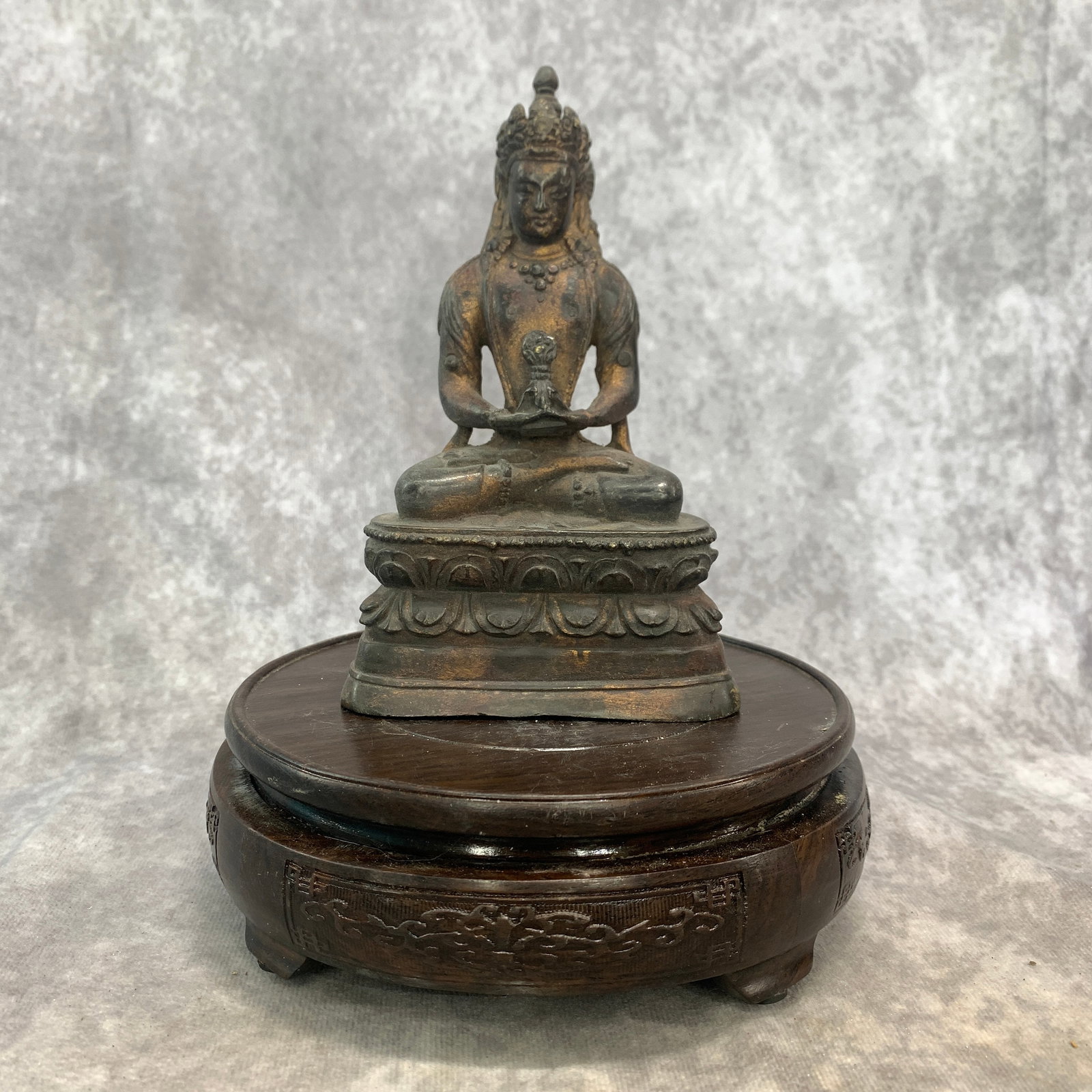 A SMALL BRONZE STATUE OF SEATED SIDDHARTHA GAUTAMA: 19th Century; Long: 3.9 inch; Width:2.3 inch; Heigh: 6.2 inch; Woodbase for picture and display only