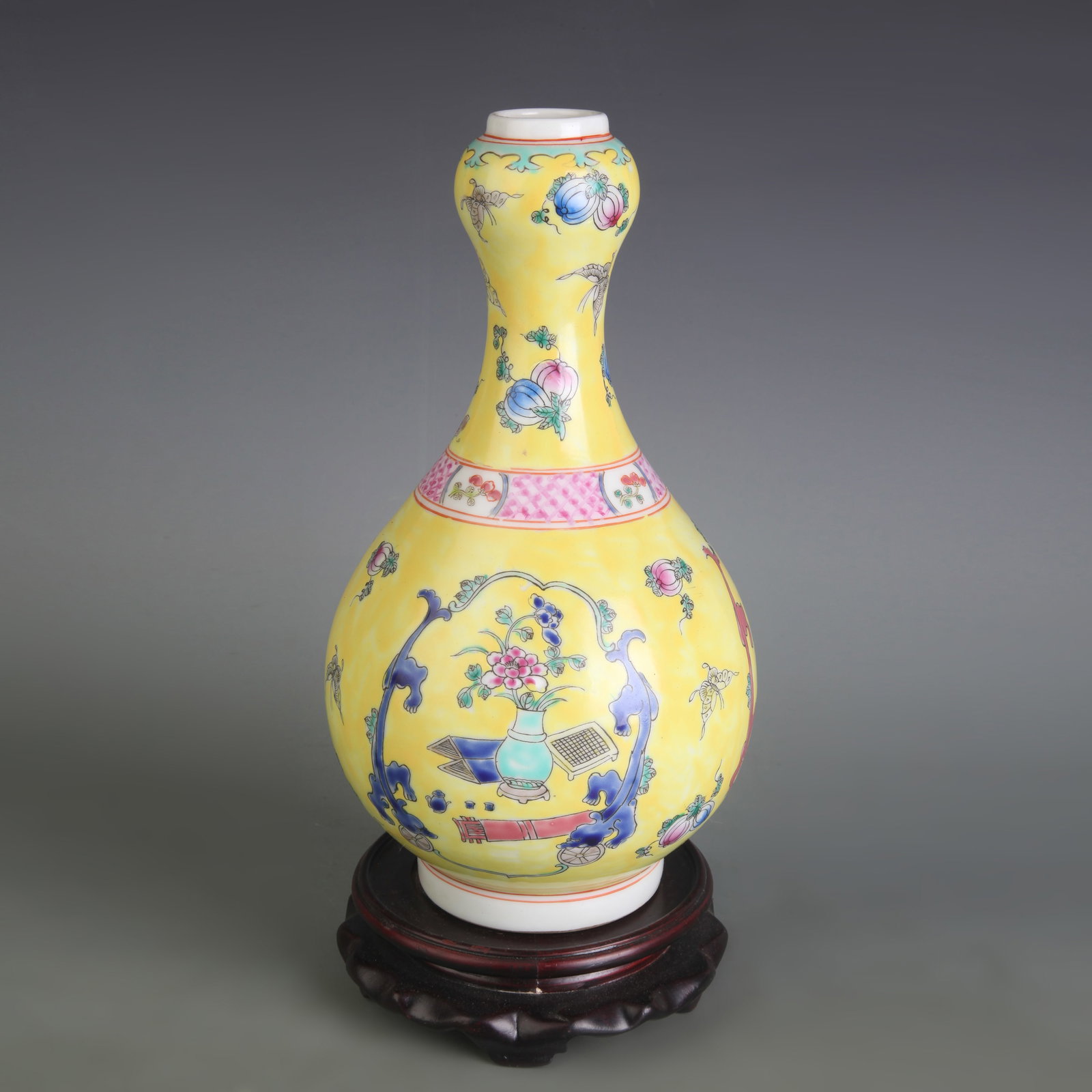 FAMILLE ROSE YELLOW-GROUND GARLIC-MOUTH PORCELAIN VASE: Qing Dynasty; Diameter: 3.1 inch; High: 9.7 inch; Woodbase for picture and display only