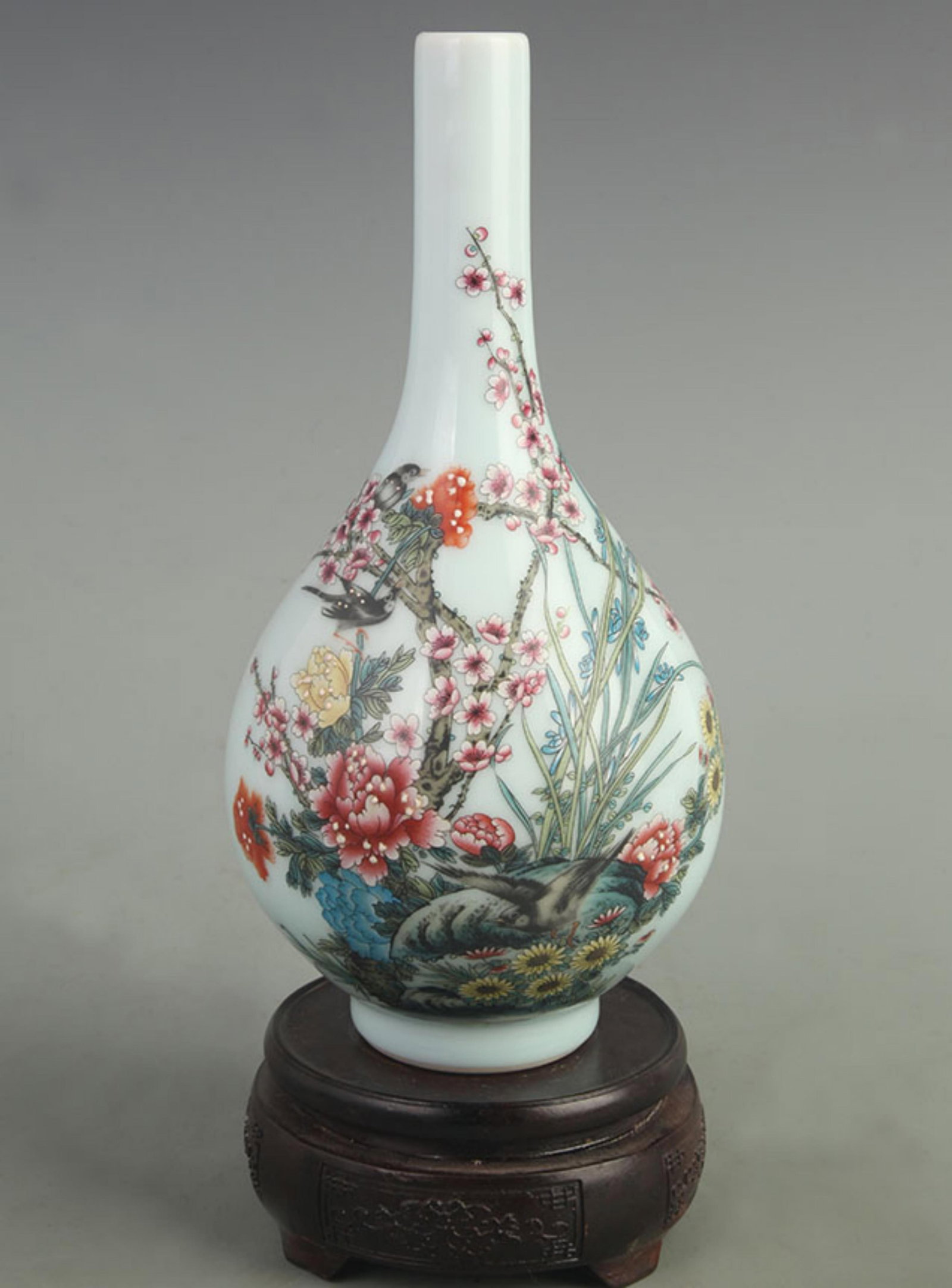 CLOISONNE ENAMEL BOTTLE WITH FLOWER AND BIRD PATTERNS: Qing Dynasty Qianlong Period; High: 10.0 inch; Width: 4.50 inch; Woodbase for picture and display only