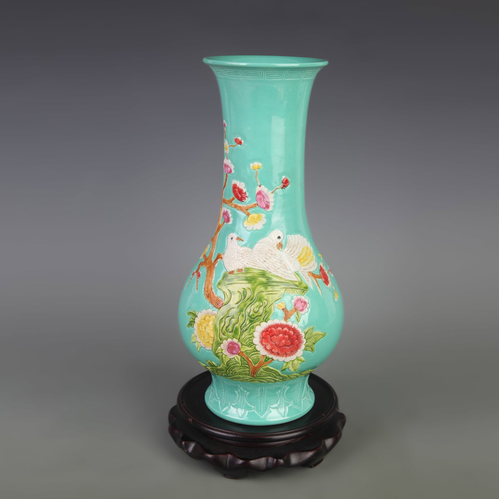 GREEN GLAZE CARVED BIRD PATTERN PORCELAIN VASE: Qing Dynasty, Diameter: 5.0 inch High: 10.7 inch; Woodbase for picture and display only