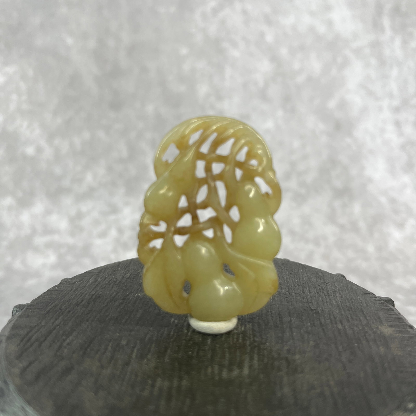 A FINE HETIAN PALE CELADON JADE IN FIGURE OF DOUBLE GROUND: Qing Dynasty; Long: 1.83 inch; Width: 1.3 inch; High: 0.3 inch; Woodbase for picture and display only