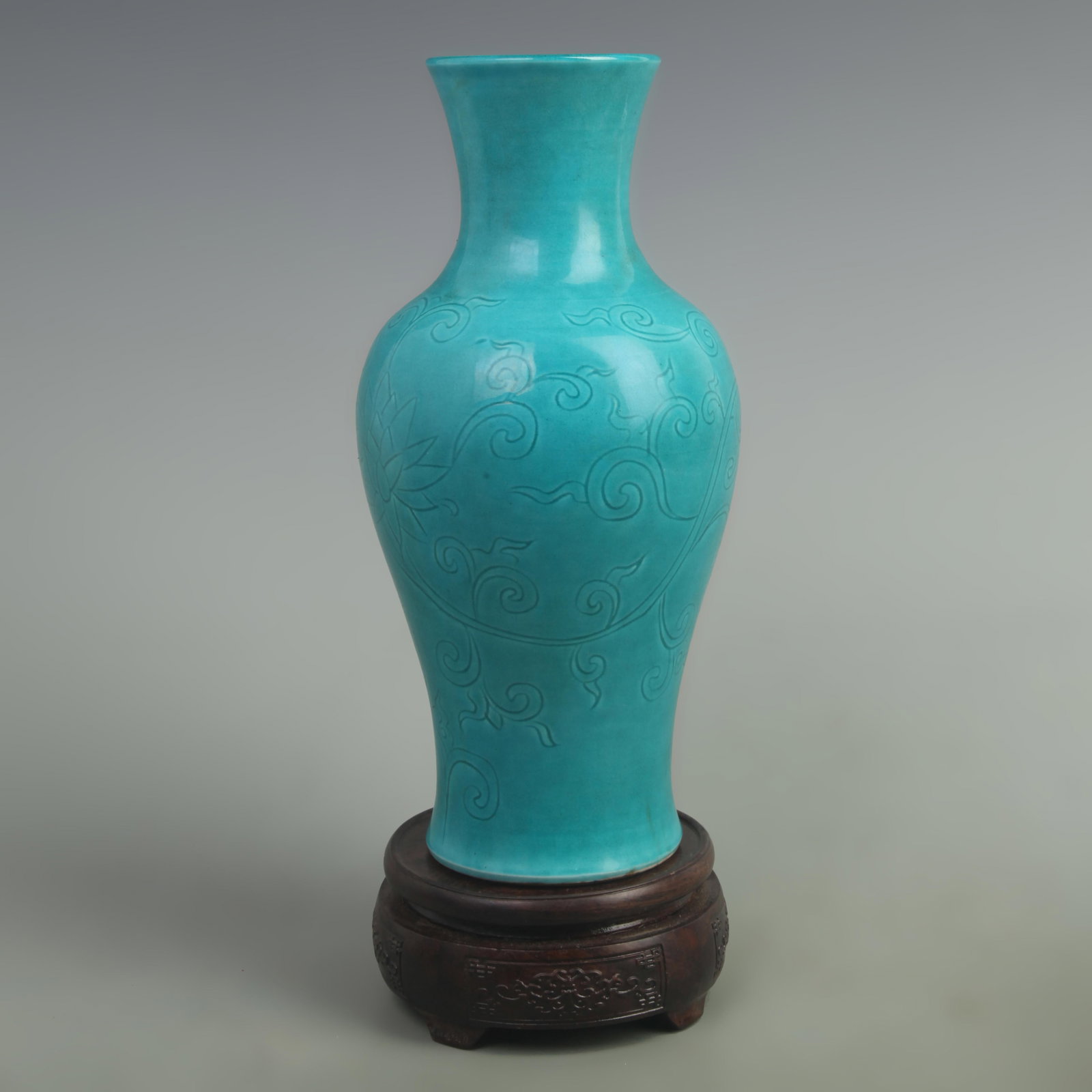 PEACOCK GREEN PEONY FLOWER CARVING GUANYIN PORCELAIN VASE: Ming Dynasty Hong Zhi Style; High: 10.3 inch; Width: 5.5 inch; Wooden base for picture and display only.