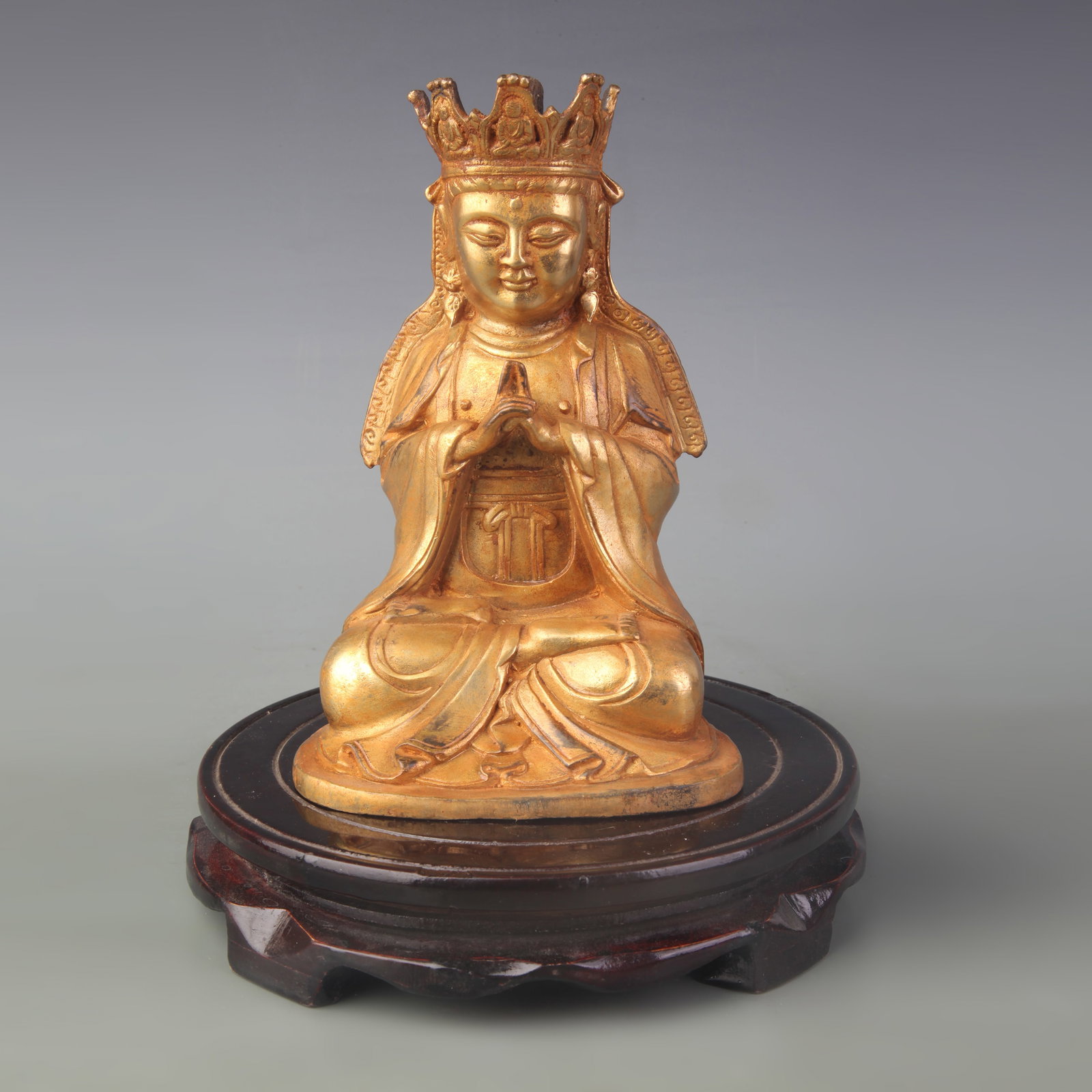 A GILT BRONZE FIGURE OF SHAKYAMUNI BUDDHA: Qing Dynasty; High: 6.7 inch; Wooden base for picture and display only.
