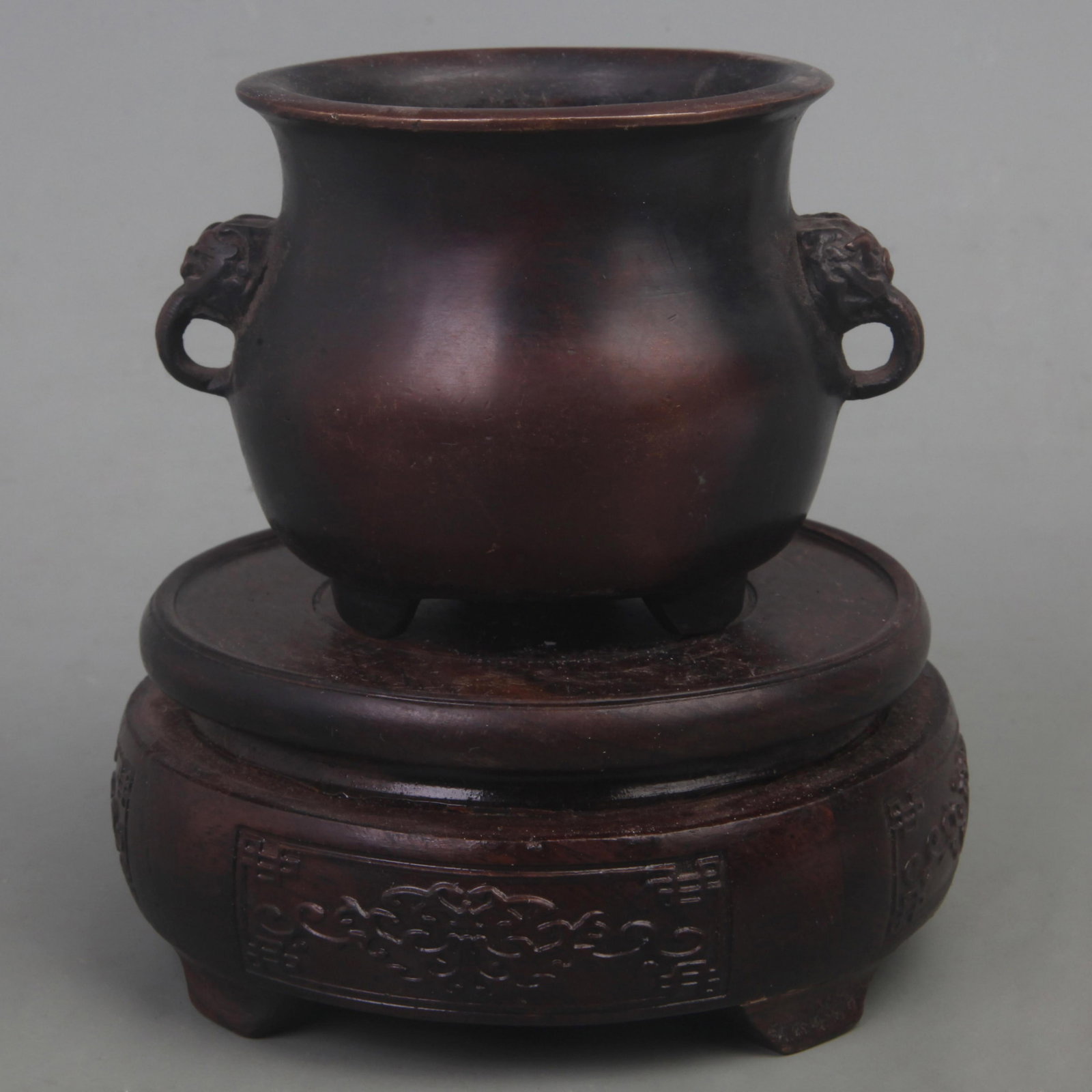 A FINE XUAN DE STYLE LION EAR THREE FOOT BRONZE CENSER: Ming Dynasty Style; Diameter: 3.8 inch; High: 2.8 inch. Wooden base for picture and display only.