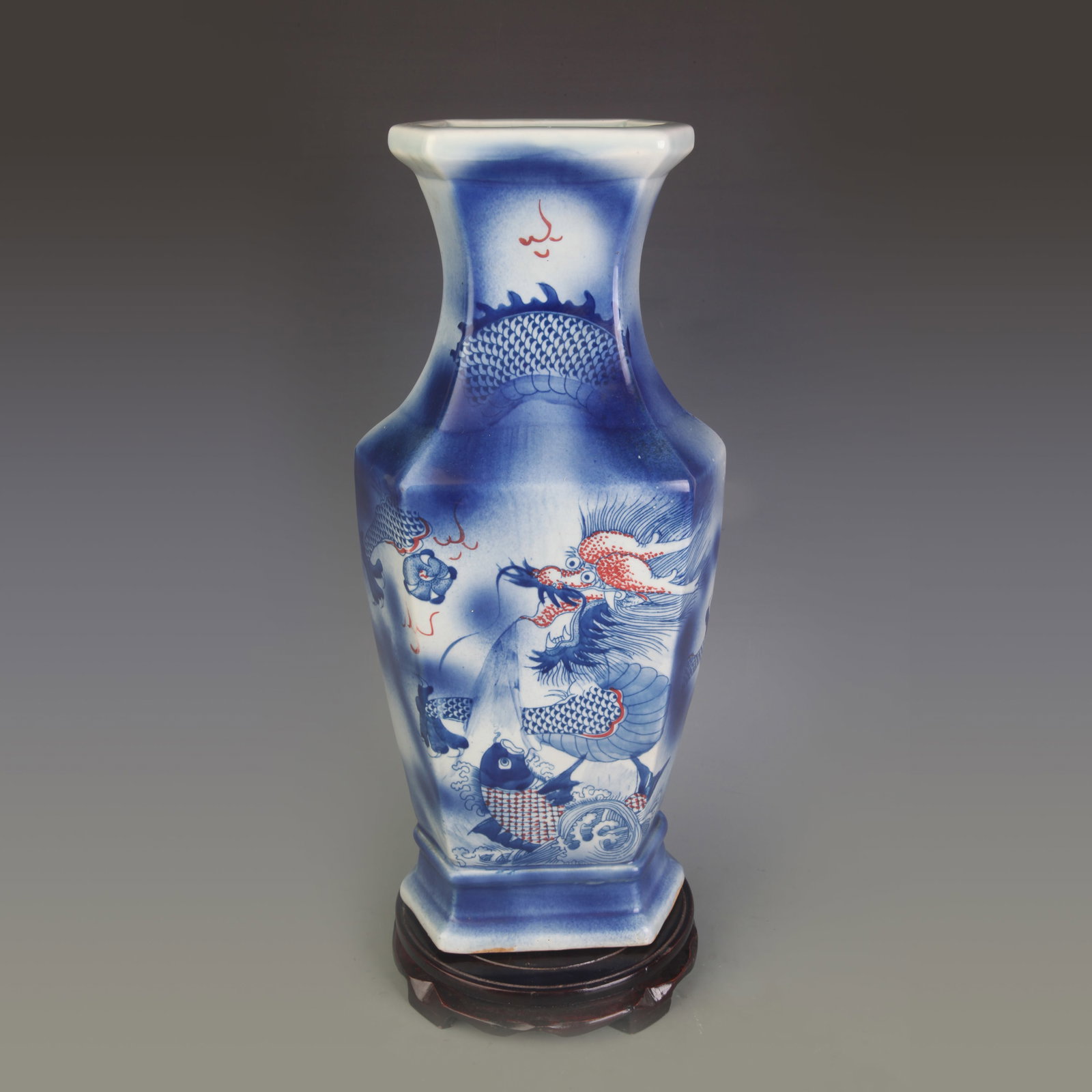 BLUE AND WHITE UNDERGLAZE RED DRAGON PATTERN HEXAGONAL VASE: Qing Dynasty Kangxi Period; High: 16.8 inch. Wooden base for picture and display only.