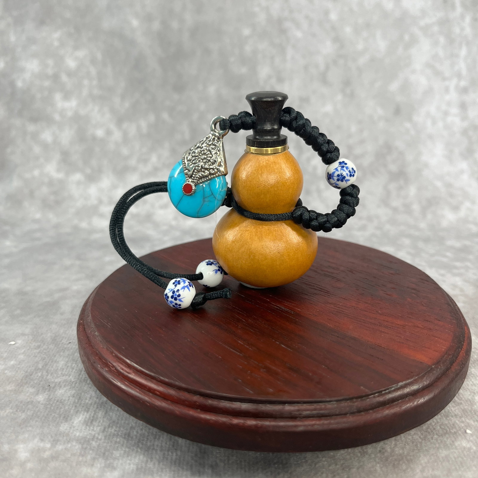 A FINE TRADITIONAL CHINESE GOURD MADE CHARM: Modern; Long: 2.1 inch; Width: 1.4 inch; High: 2.1 inch. Wooden base for picture and display only.