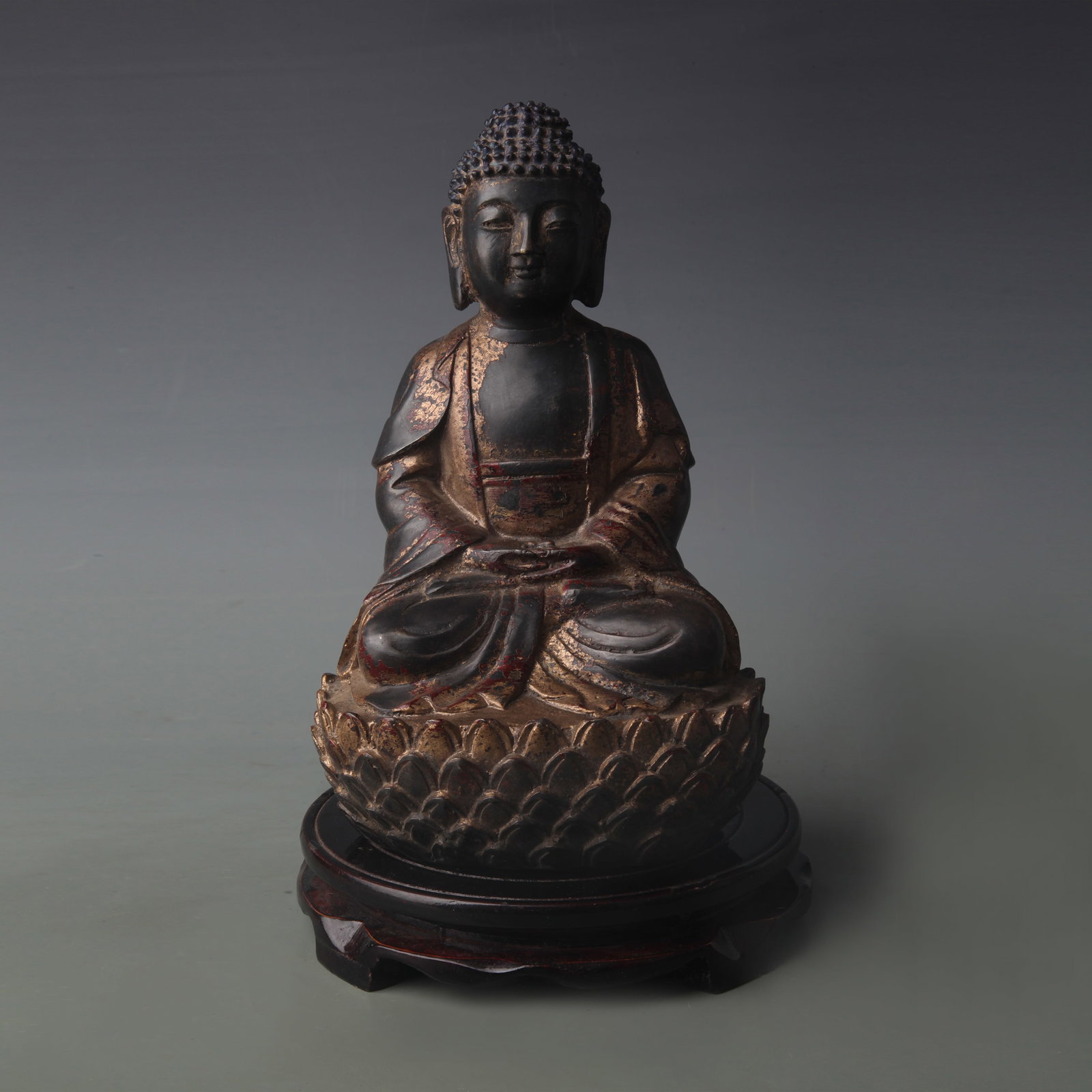 A FINE BRONZE STATUE OF SHAKYAMUNI BUDDHA: Ming Dynasty Style; Width: 6.0 inch; High: 9.6 inch; Wooden base for picture and display only.