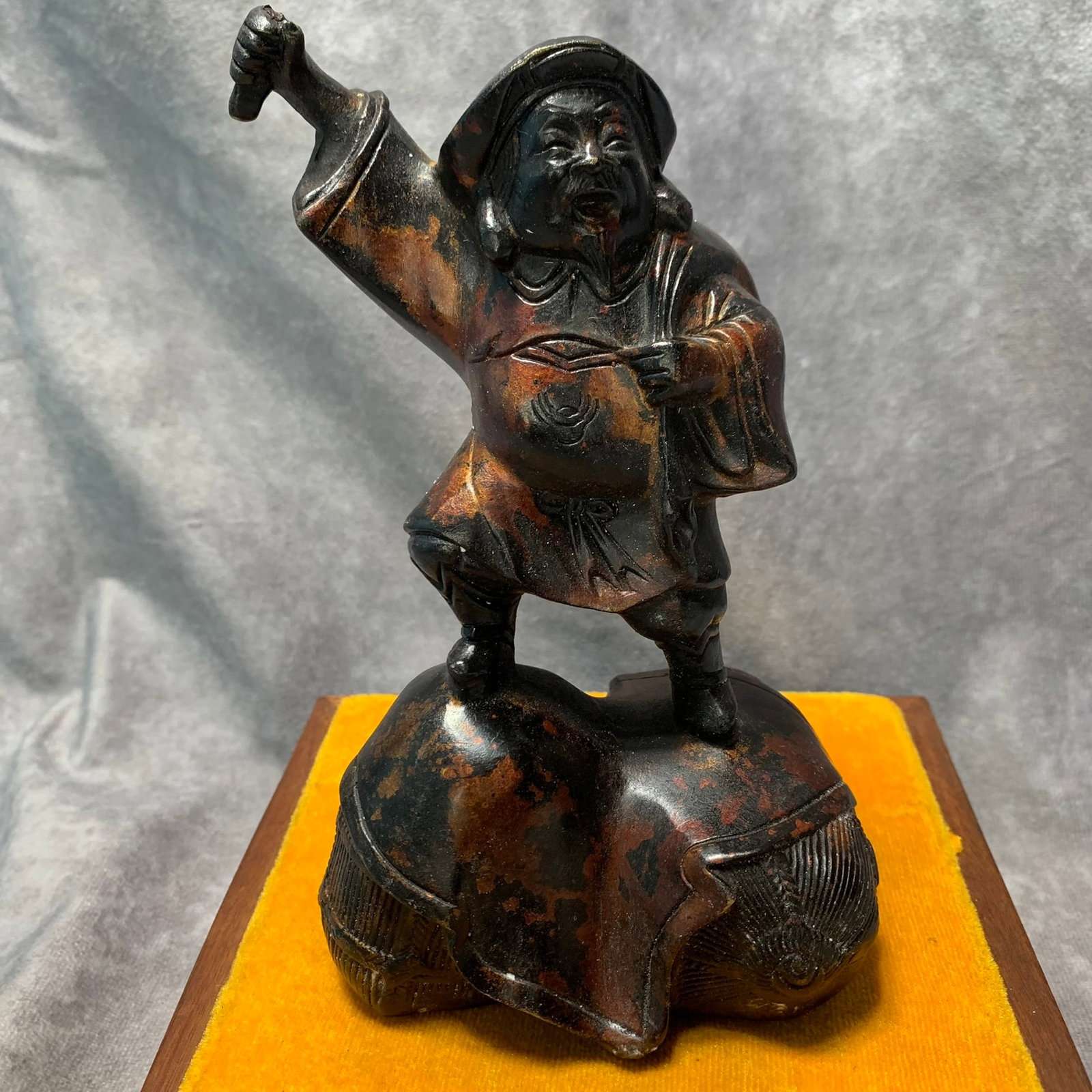 A BRONZE FIGURE OF A FARMER (1 of 5)