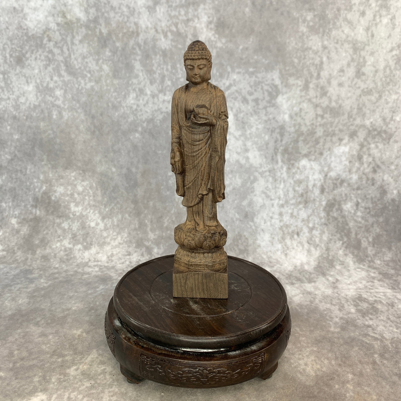 A FINE AGARWOOD MEDICINE BUDDHA CARVING: 20th Century; Long: 1.9 inch; Width: 1.5 inch; High: 8.3 inch. Wooden base for picture and display only.