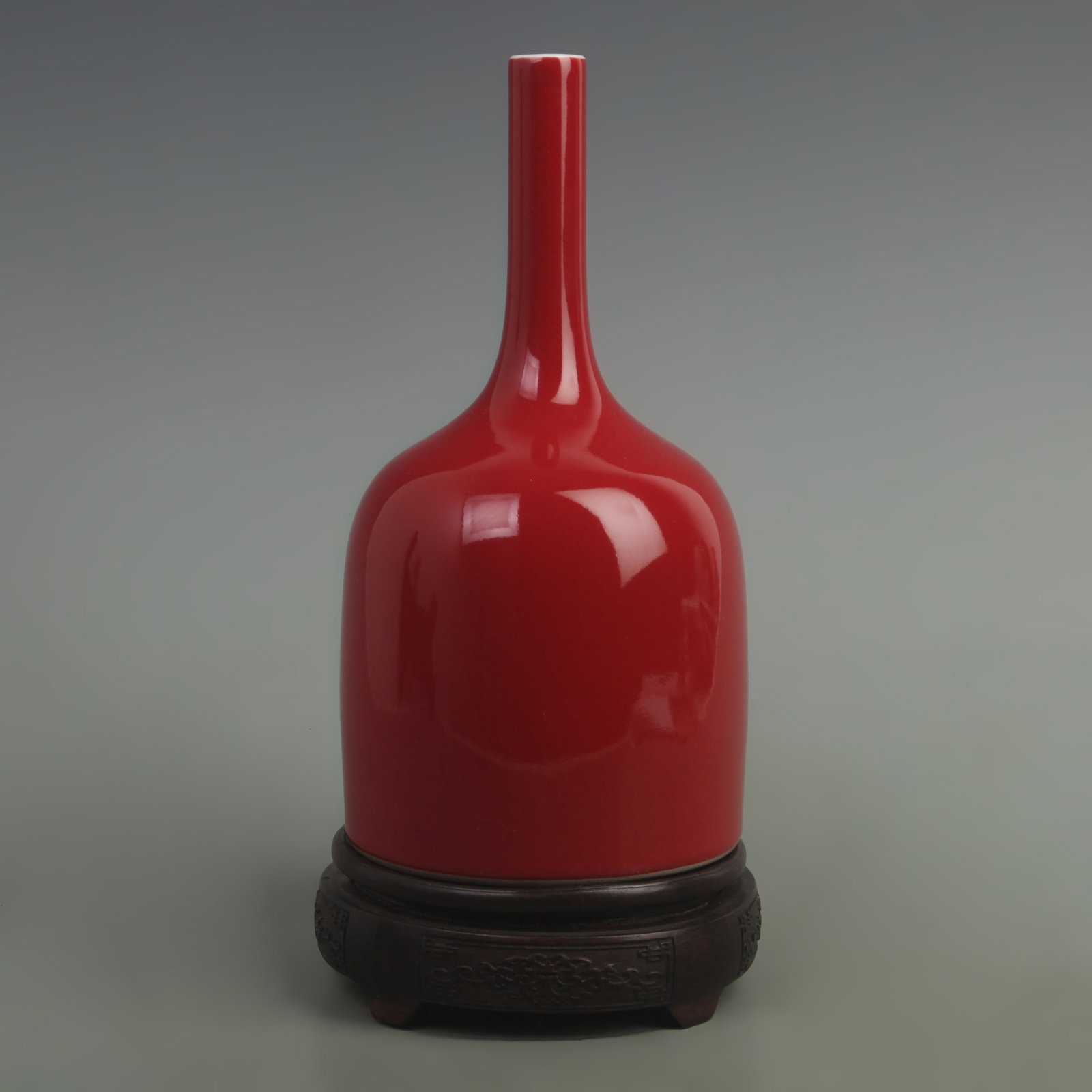 A FINE RED COLOR GLAZED BELL-SHAPED PORCELAIN BOTTLE: Qing Dynasty Qian Long Period; High: 9.5 inch; High: 4.8 inch. Wooden base for picture and display only.
