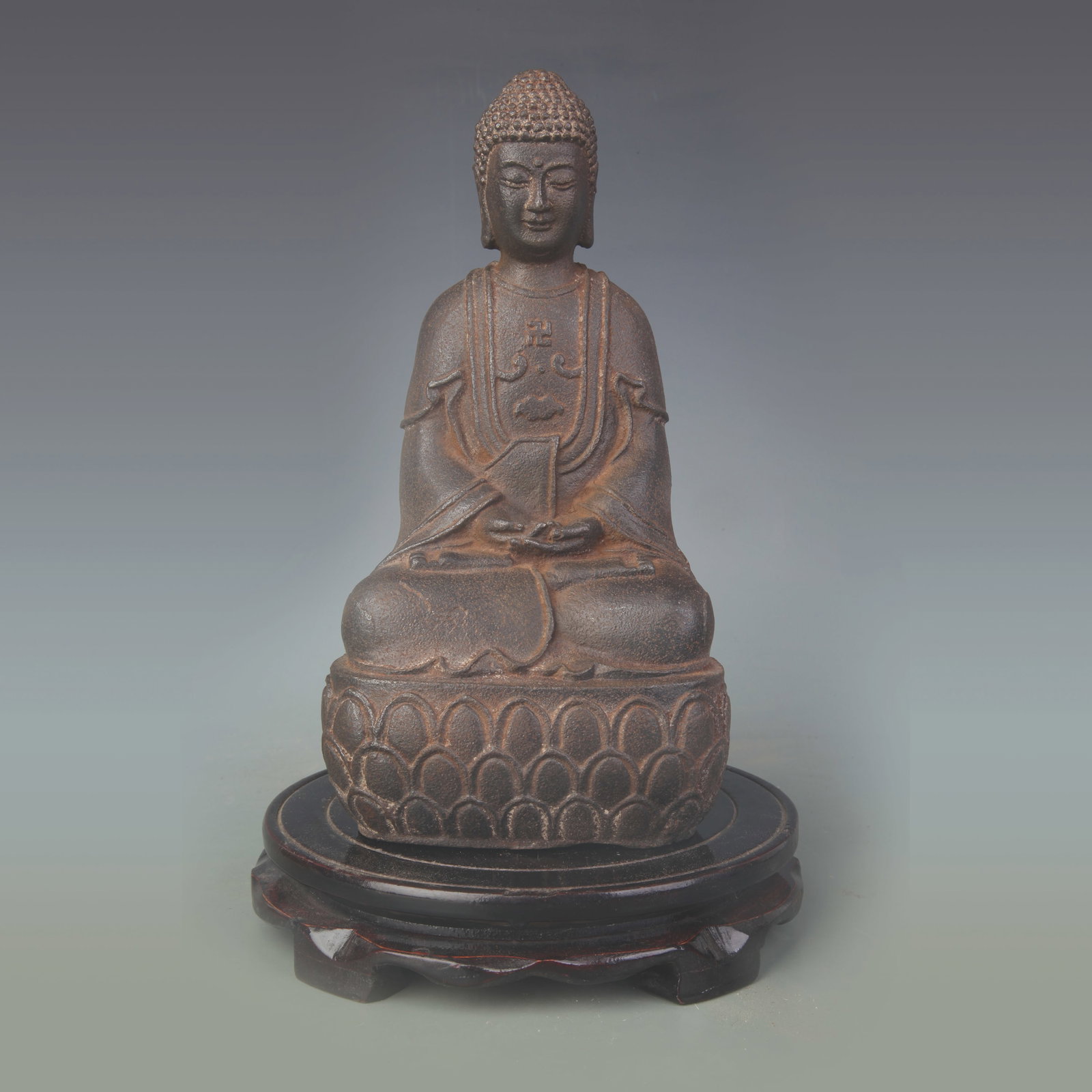 A CAST IRON FIGURE OF SHAKYAMUNI BUDDHA (1 of 6)