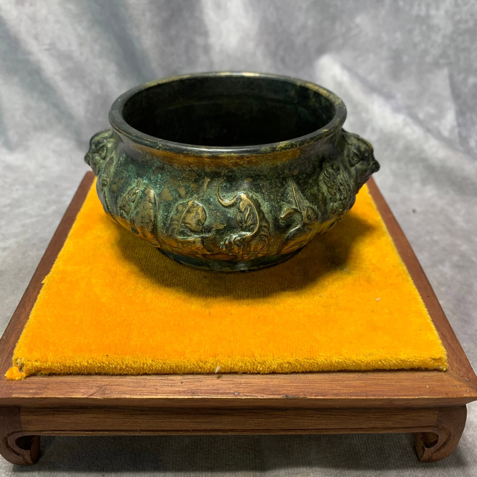 A QIANLONG MARKED ZODIAC CENSER WITH LION-HEAD HANDLES: Qing Dynasty; H; 2.2 inch; D; 4.8 inch; Wooden base for picture and display only.
