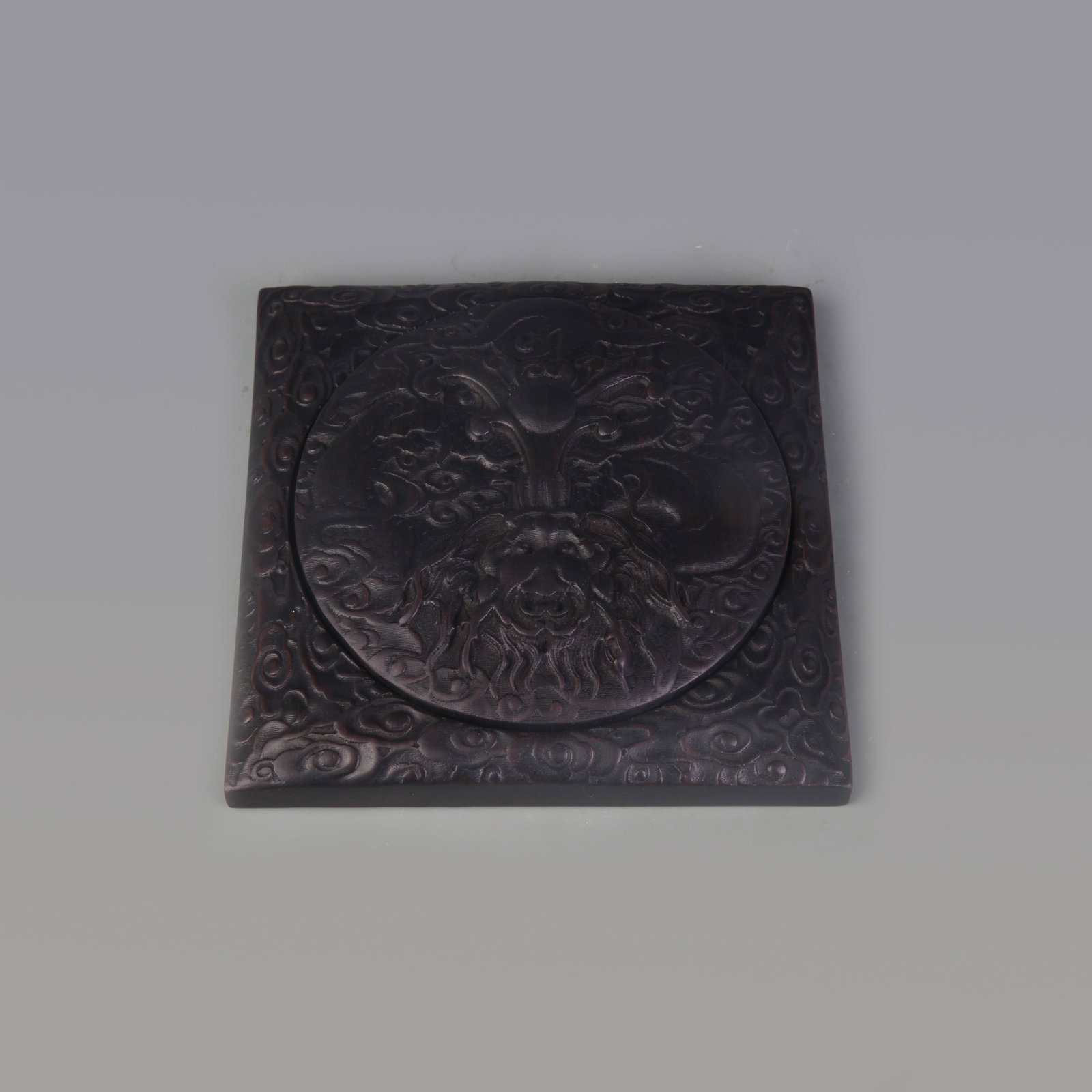 ZITAN WOOD INKSTONE WITH DRAGON DESIGN: Qing Dynasty; Width: 5.7 inch; High: 1.2 inch; Wooden base for picture and display only.
