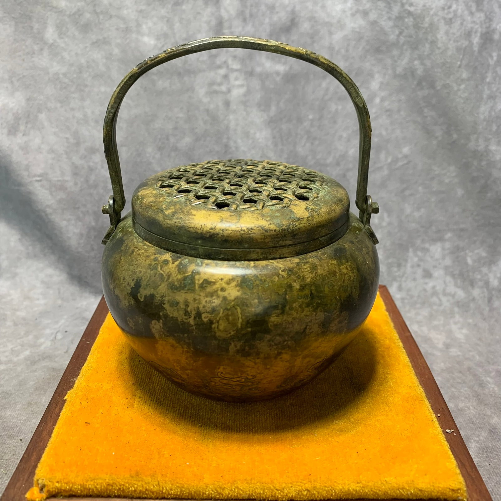 QIAN LONG MARK BRONZE TWELVE ZODIAC HAND WARMER: Qing Dynasty; High: 5.4 inch; Diameter: 4.5 inch; Wooden base for picture and display only.