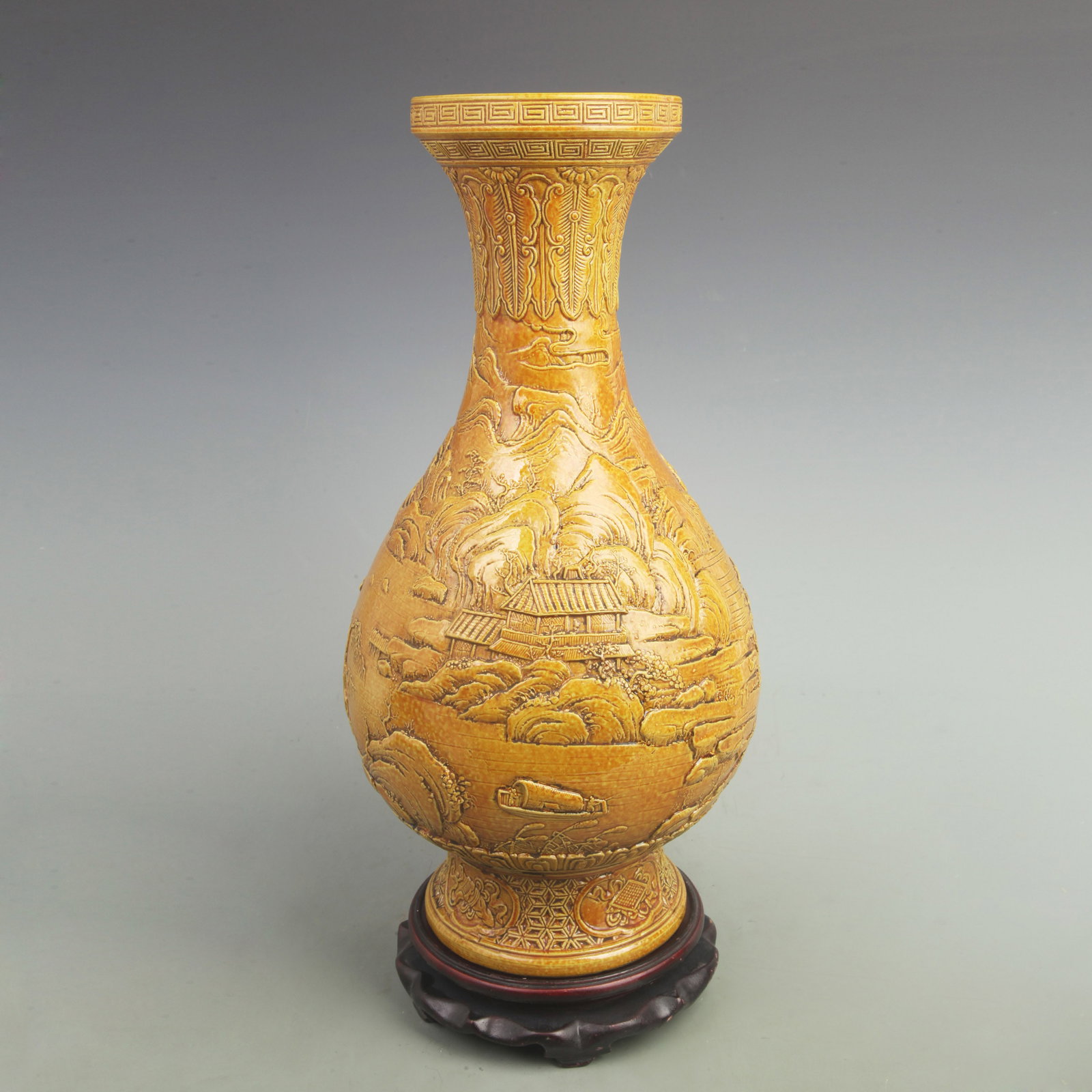 YELLOW GROUND CARVED LANDSCAPE PATTERN PORCELAIN VASE: Qing Dynasty,Dao Guang Period; Diameter: High: 17 inch; Width: 9.2 inch. Wooden base for picture and display only.