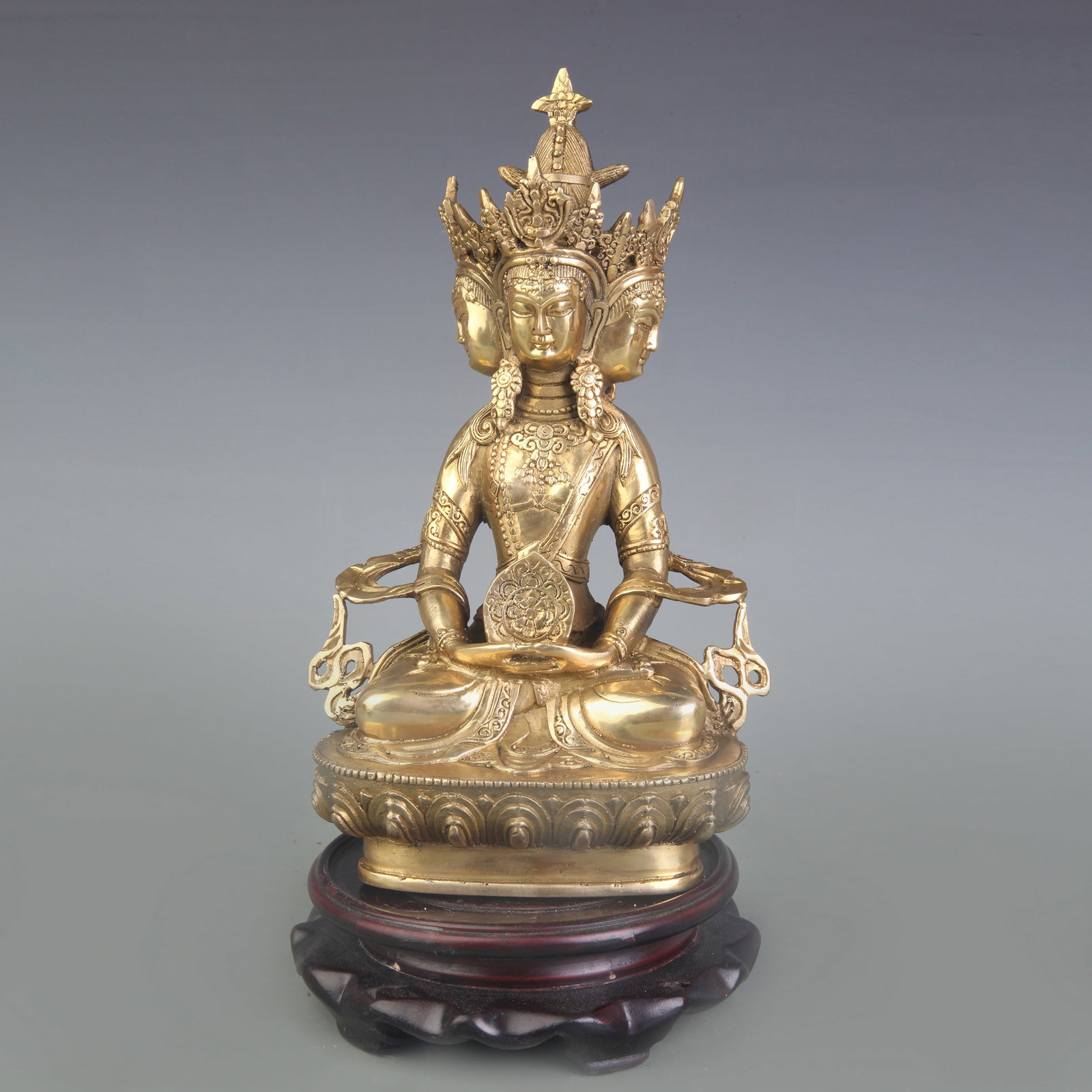 A FINE BRONZE STATUE OF BUDDHA VAIROCANA "HERR DER MITTE": Qing Dynasty; High: 8.7 inch; Wooden base for picture and display only.