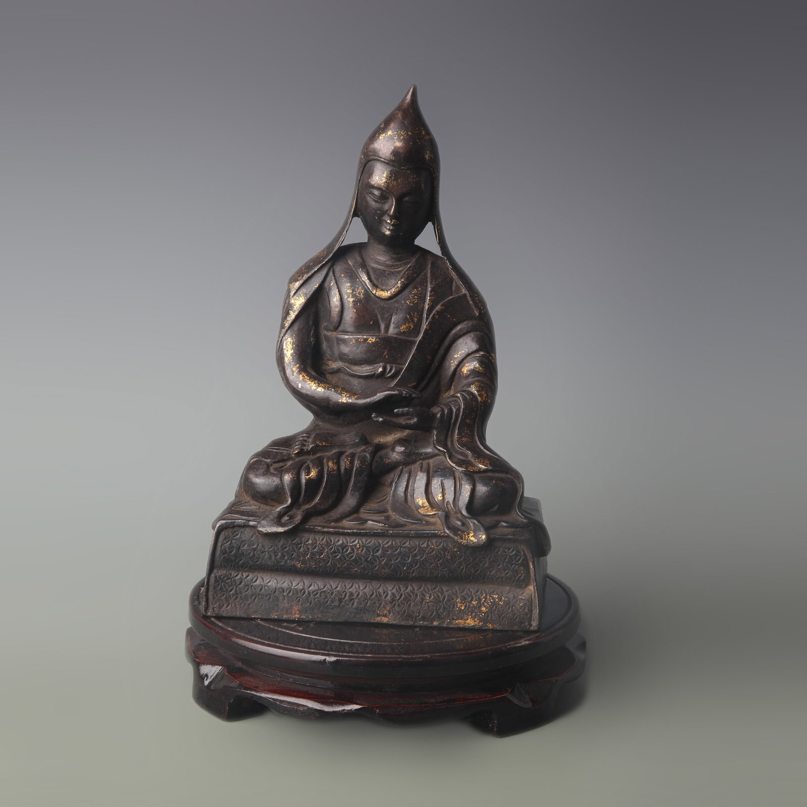 A FINE BRONZE FIGURE OF JE TSONGKHAPA: Qing Dynasty; High: 8.7 inch; Wooden base for picture and display only.